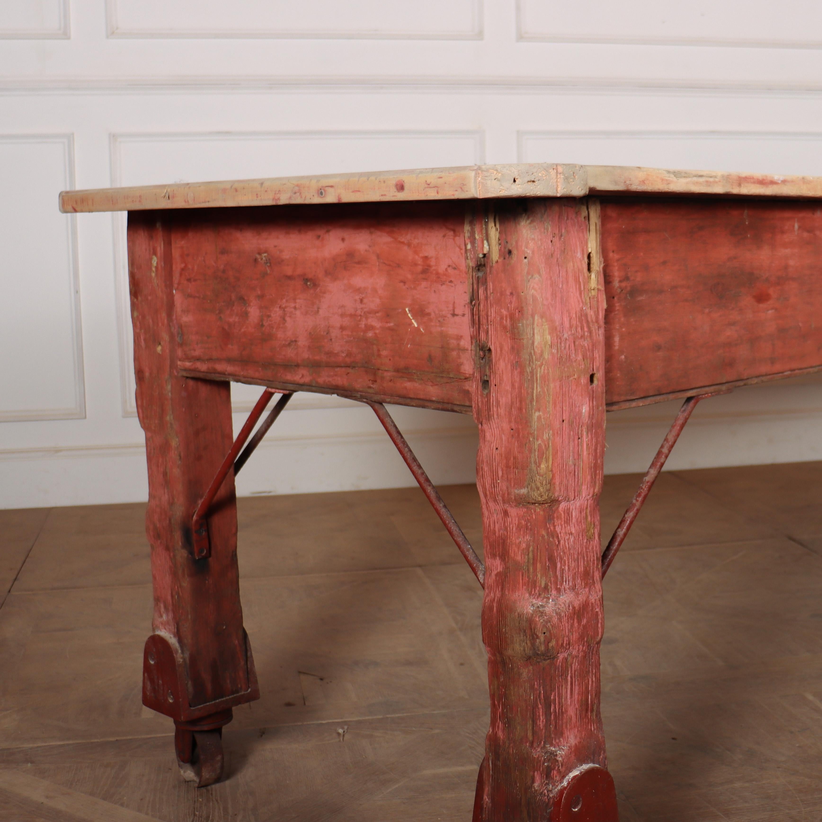 Stunning 19th C sycamore topped preparation table with an original paint finish to the base and large industrial castors. Great wear to the whole piece but very stable and functional. 1880.

Clearance is 24