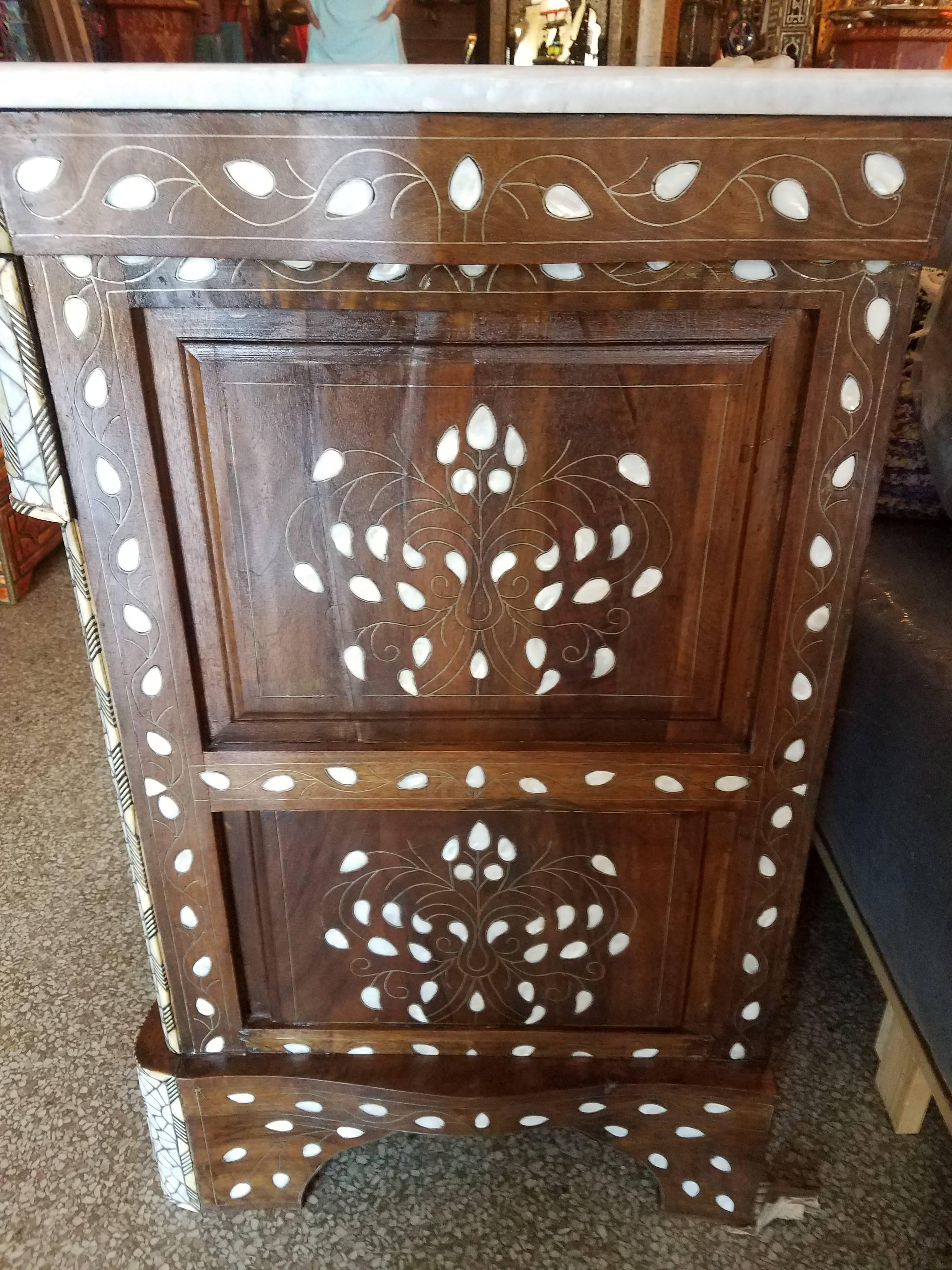 Syrian style mother-of-pearl dresser or cabinet made in Morocco by a fine Syrian artisan. Color is Ivory (off white). Beautiful inlay throughout. Amazing handcraftsmanship. Definitely a conversation piece. Three easy to open drawers and a beautiful