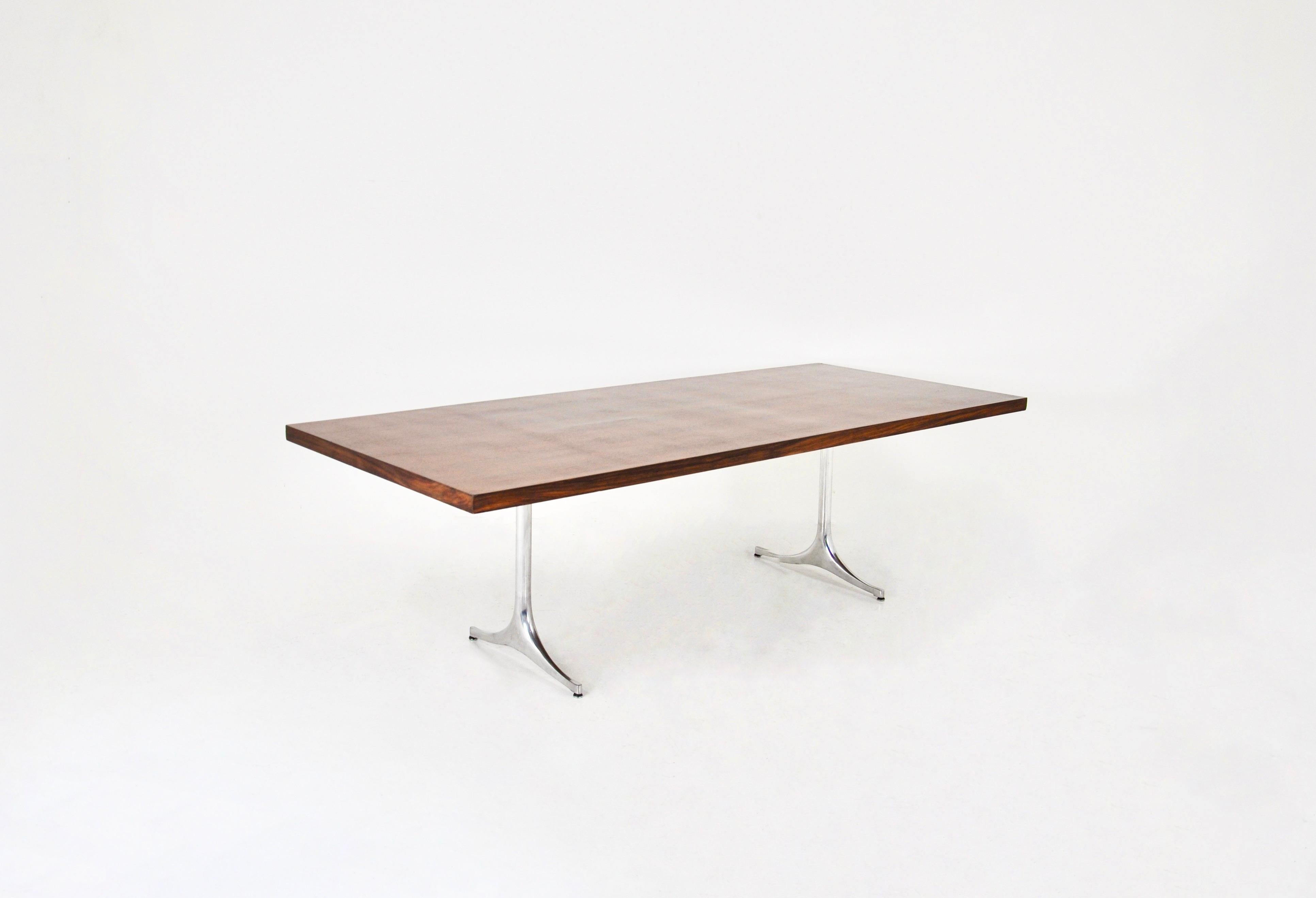 Wooden table with metal legs by George Nelson. Numbered on the leg. Wear due to time and age of the table.
