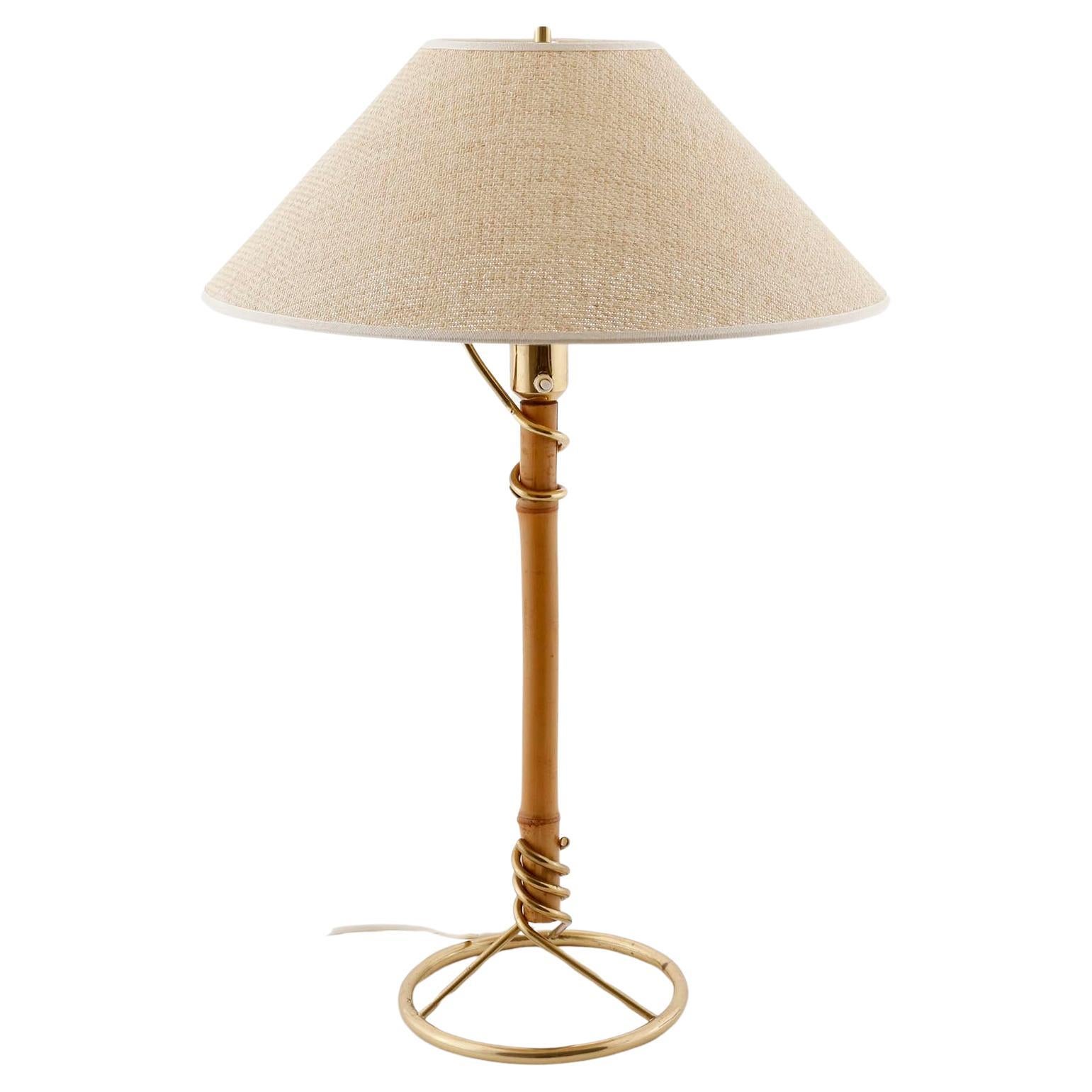 A gorgeous table or desk lamp made of polished brass and bamboo manufactured in Austria, Vienna, in 1950s or early 1960s. The piece is attributed to Austrian lighting maker J.T. Kalmar.
Kalmar collaborated with several renowned Austrian architects,