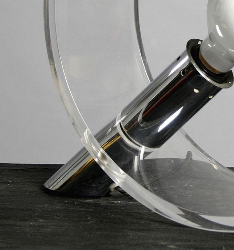 This is a good size, sculptural acrylic and chrome table or desk lamp designed by Atelier A. The curved acrylic base sits on a chrome foot which holds the light fitting, Circa 1970`s, French.

Atelier A was a creation of Francoise Arnal in 1969 as