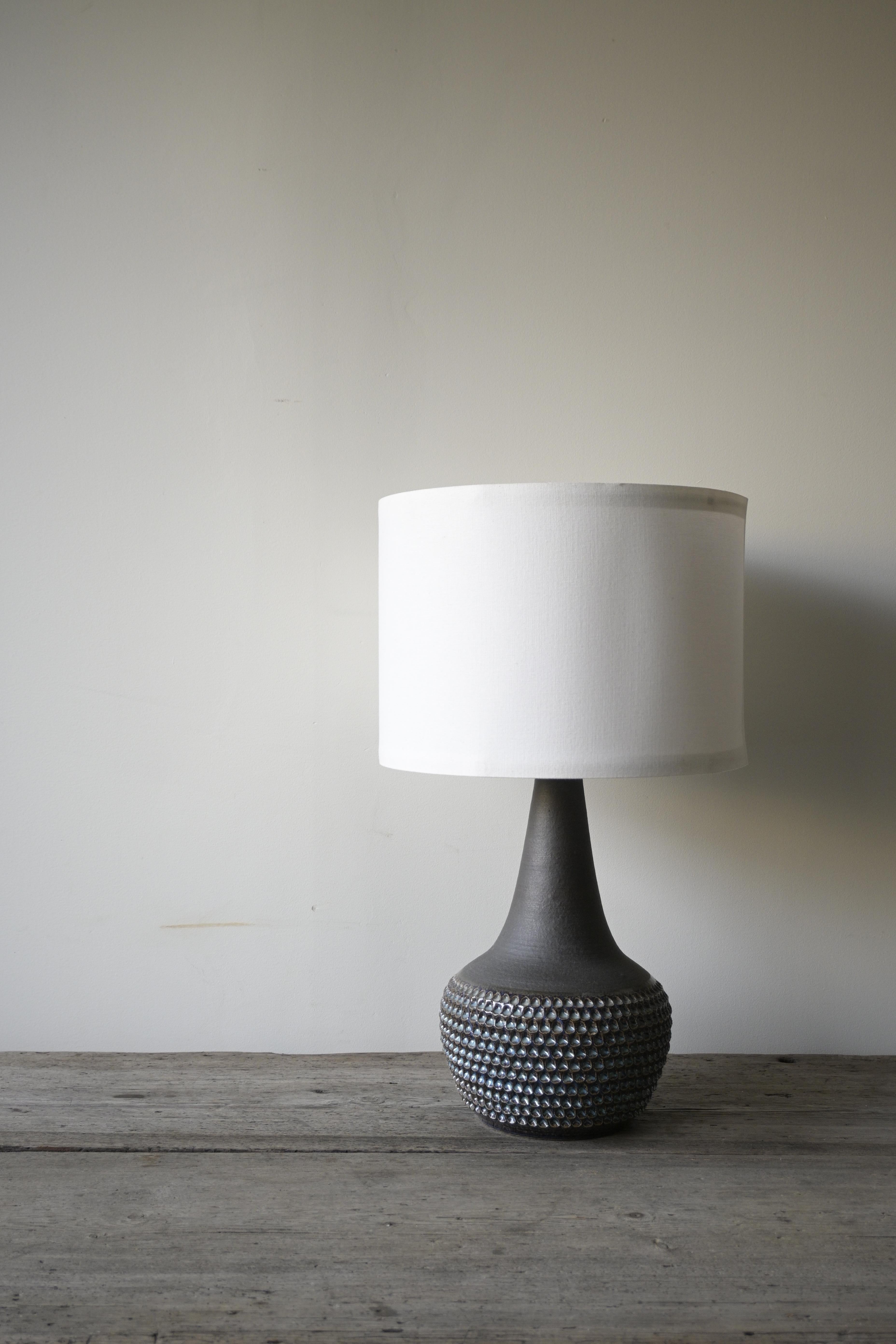 Large Table Lamp by Einar Johansen for Søholm Stentøj, Denmark, 1960s

Beautiful stoneware table lamp features a multicolored glazed surface in brown, blue, and white colors.

ChatGPT sade:

Great condition, with the exception of one chip