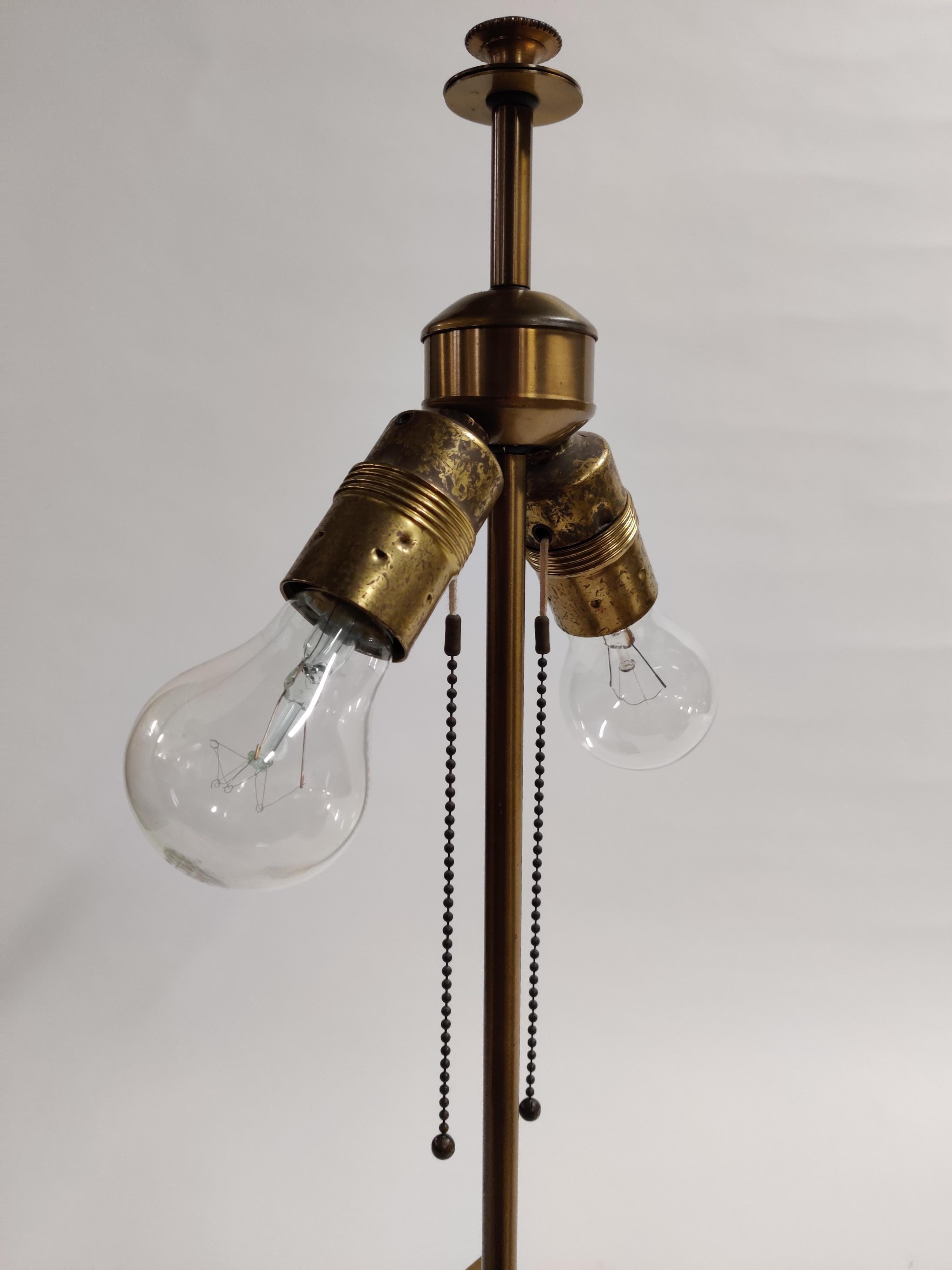 Huge brass and chrome table lamp by Gaetano Sciolari.

This lamp has been left as it is with a beautiful patina.

The lamp emits a beautiful warm light.

It consists of two E26/E27 light bulb holders with individual pulling cords.

Tested