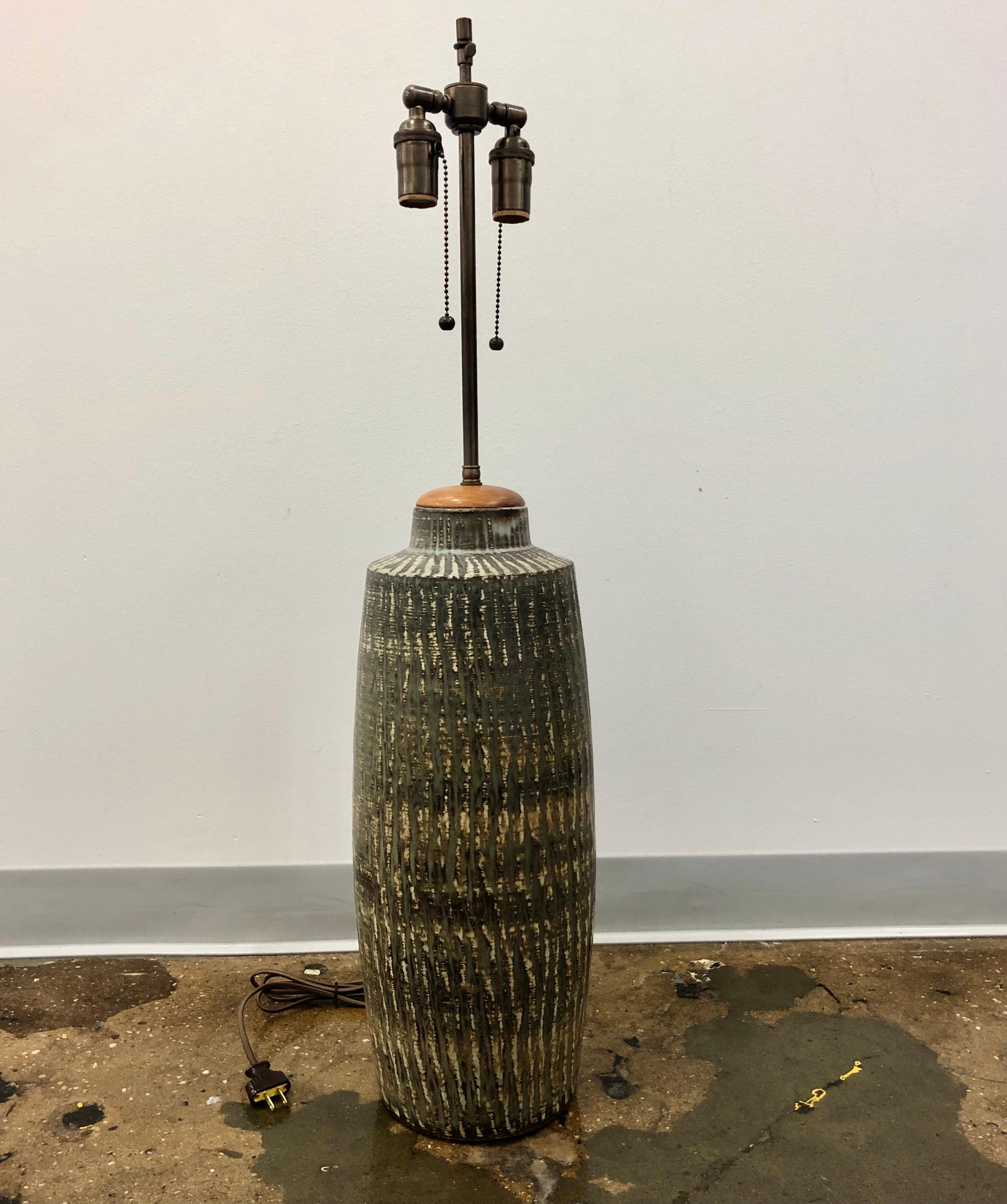 Large vase , now a table lamp by Gunnar Nylund for Rostrand, Sweden , Circa 1960.
Signed and marked by manufacturer.
Newly rewired. Stoneware base dimensions 21
