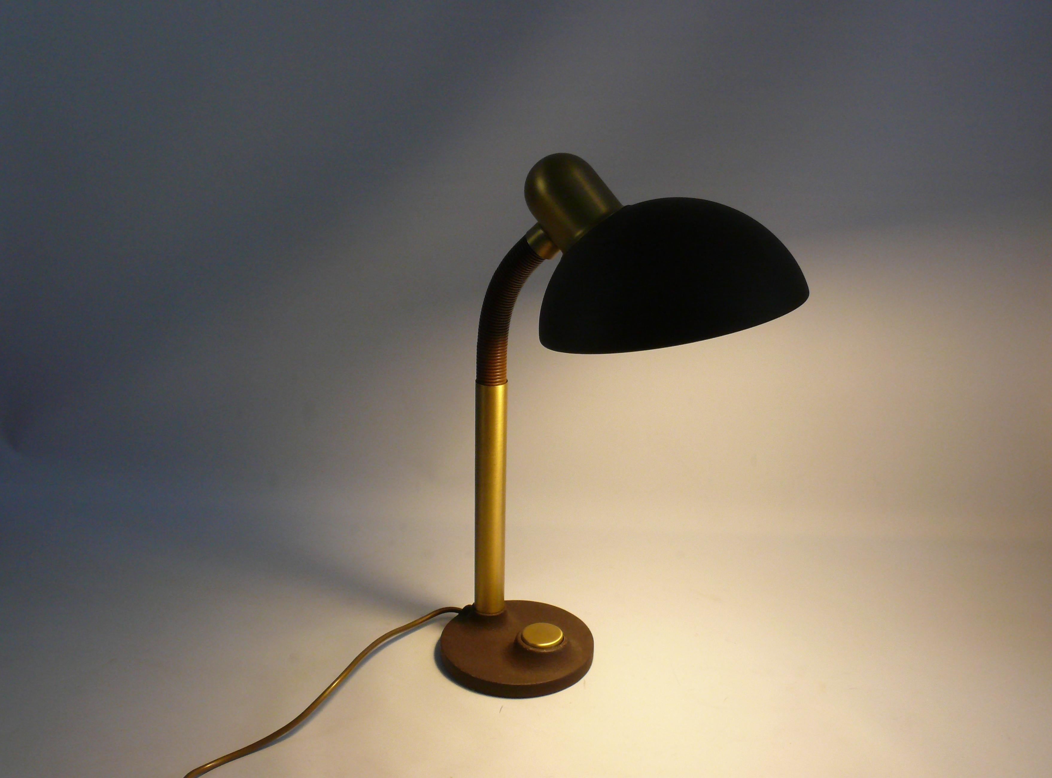 Rare, very large desk lamp from the 1960s - 1970s by Egon Hillebrand, model 7630. The lamp is made of metal and brass and has a plastic-coated gooseneck. The desk lamp is large, heavy and very solid. The paint is matt brown and the cable is gold.