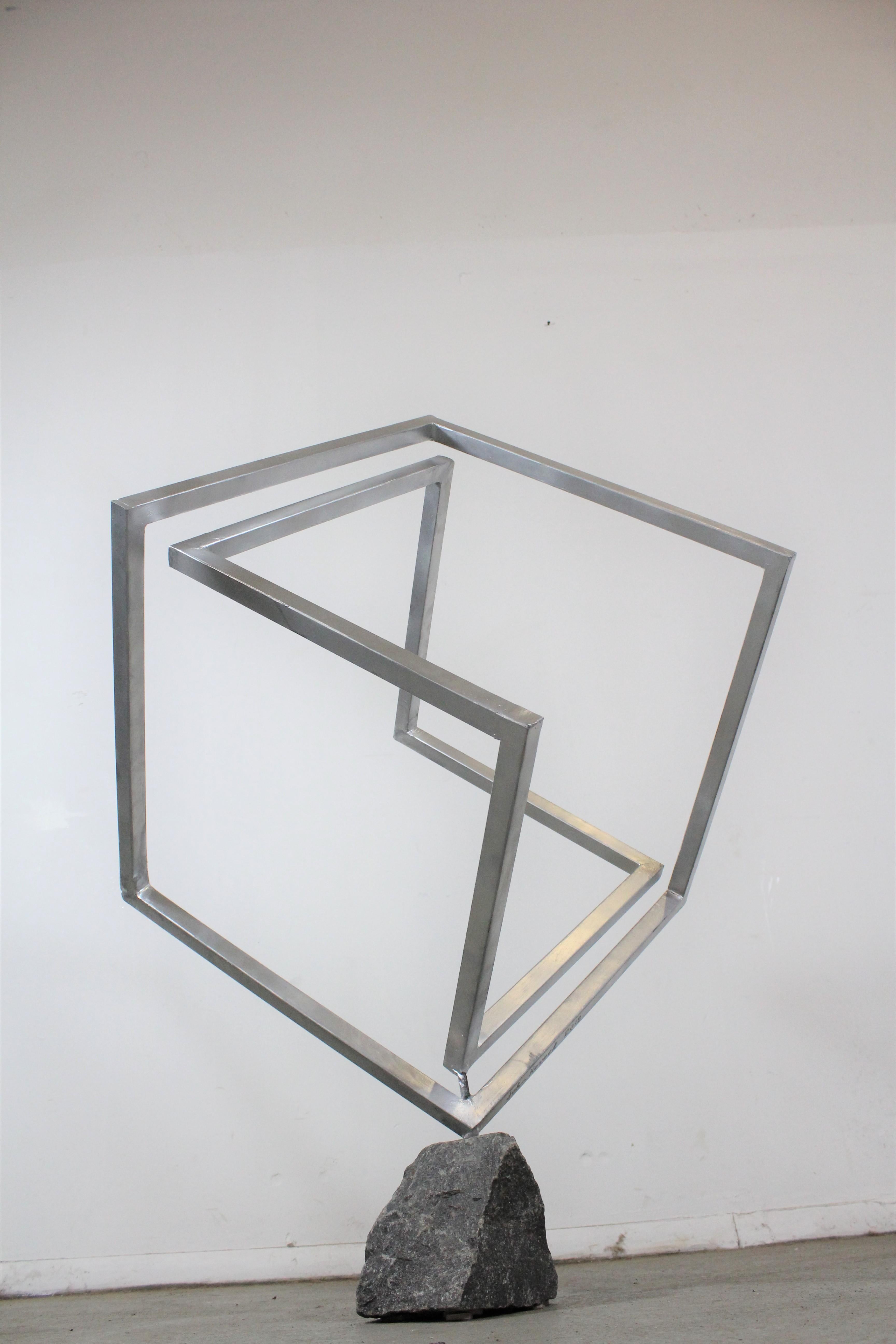 Mid-Century Modern Style 3D Cube Sculpture 
Offered is a beautifully unique sculpture. The piece is made of tube steel which has been painted silver. It is in good condition, showing some wear on the paint. The cubic structure is attached to a solid