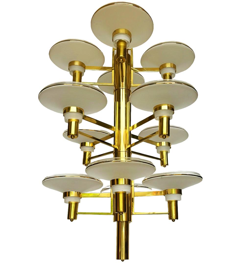 A large and impressive tall chandelier circa 1980's and probably Italian. It features gold-plated brass framing with art glass shades in a spiral form. Tested and working. Takes 12  stand size bulbs. 