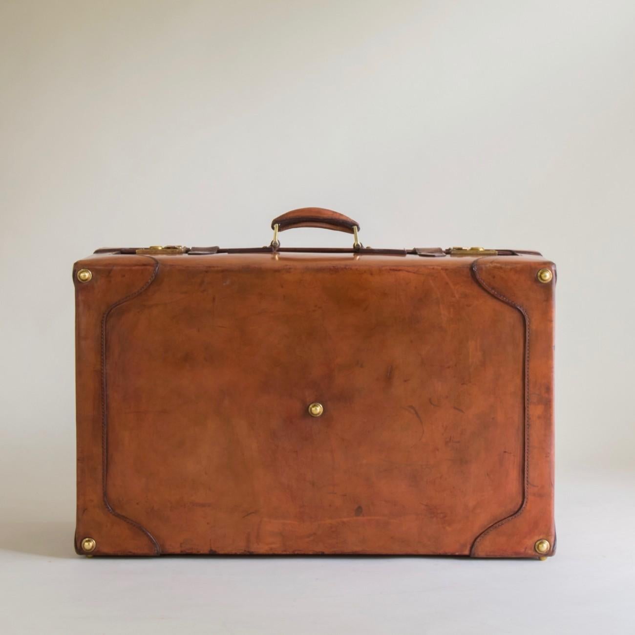 vintage leather suitcase with straps