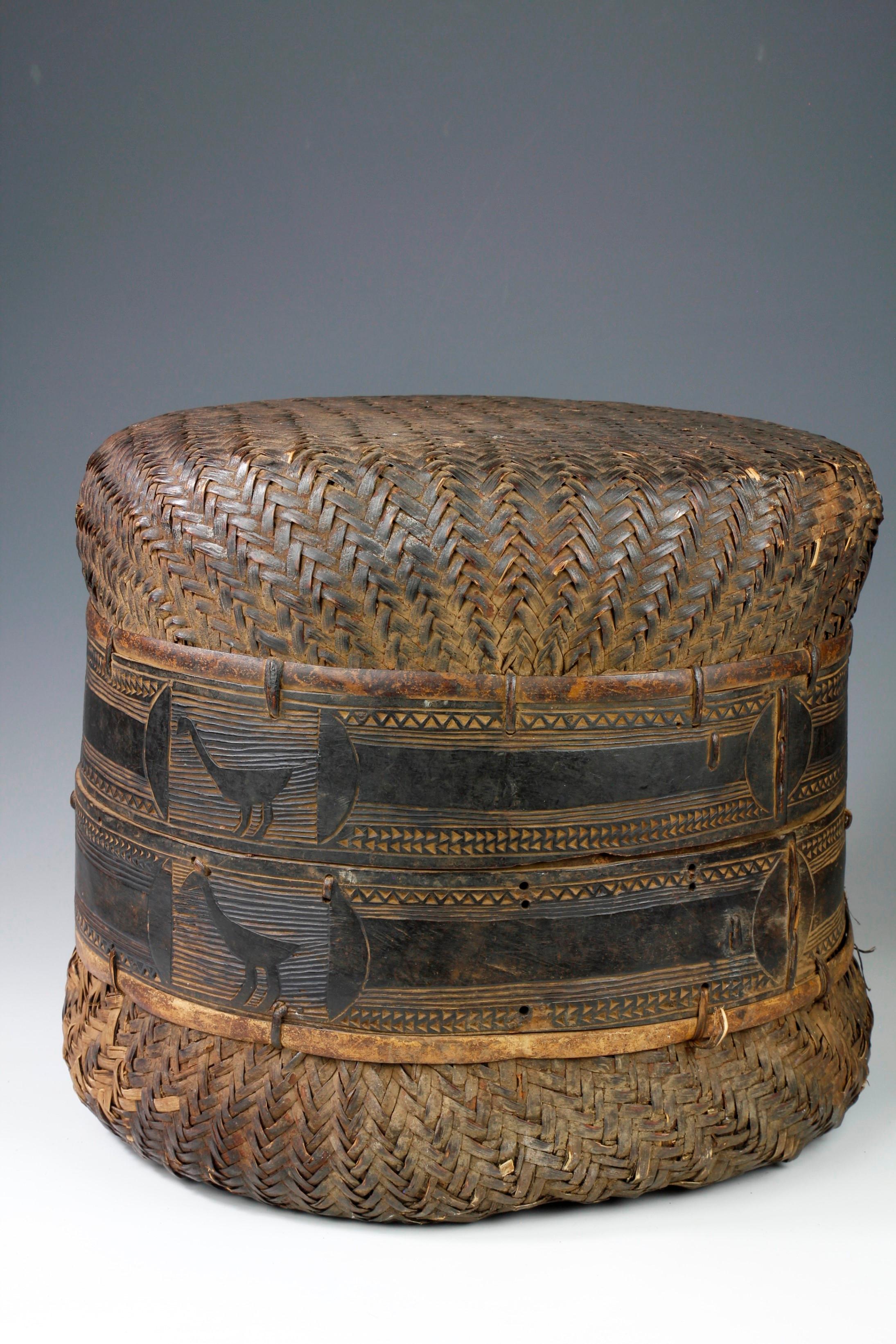 This large, two-sectioned woven cane Wagogo storage basket from Tanzania has been beautifully decorated with depictions of animals around the central band. This is one of the nicest baskets of this type that I have come across, and has been part of