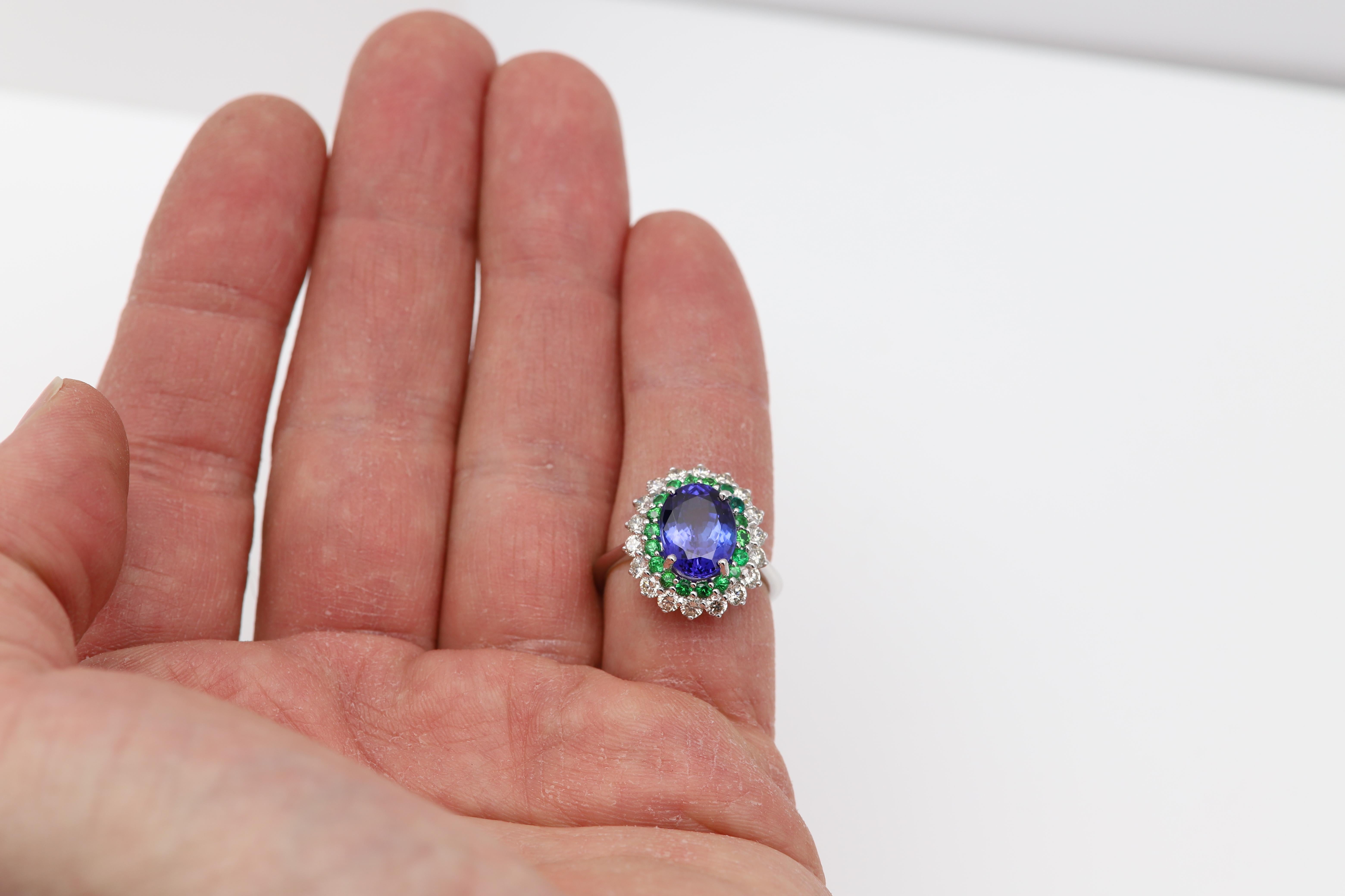 Oval Cut Large Tanzanite 4.20 Carat Diamond Tsavorite Ring 18 Karat Gold For Sale