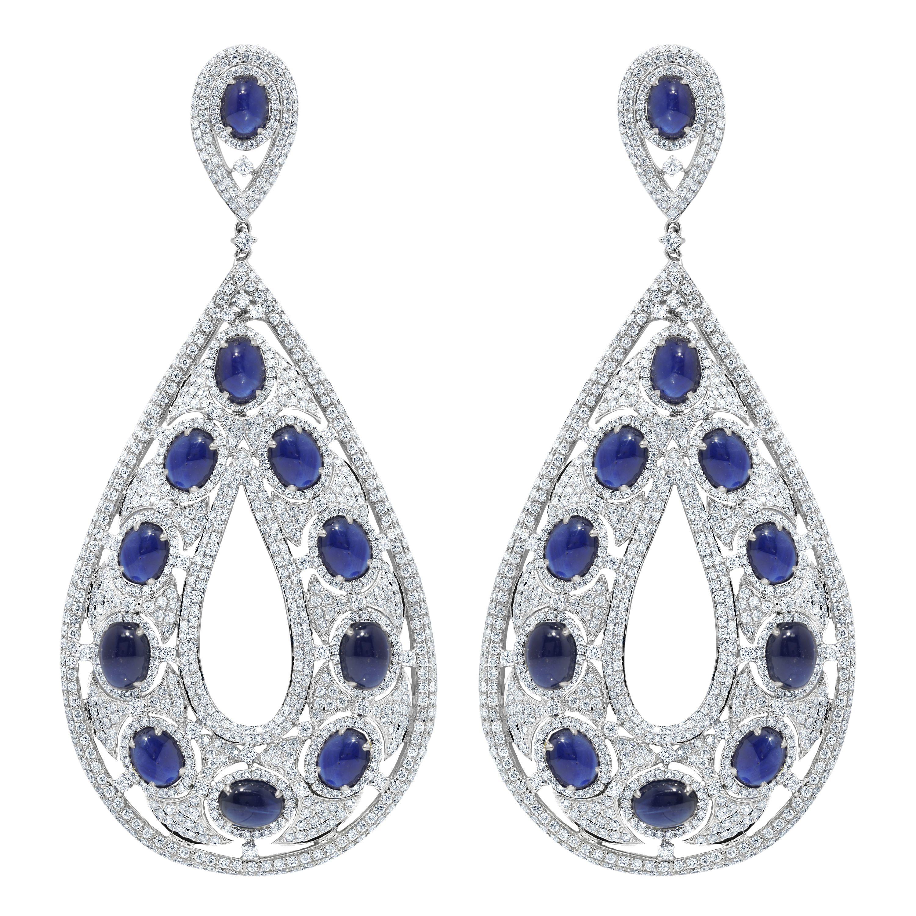 18 kt white gold diamond tear drop shaped earring adorned with 62.46 cts tw of oval cut cabochon sapphires surrounded by 14.75 cts tw of diamonds
4.5