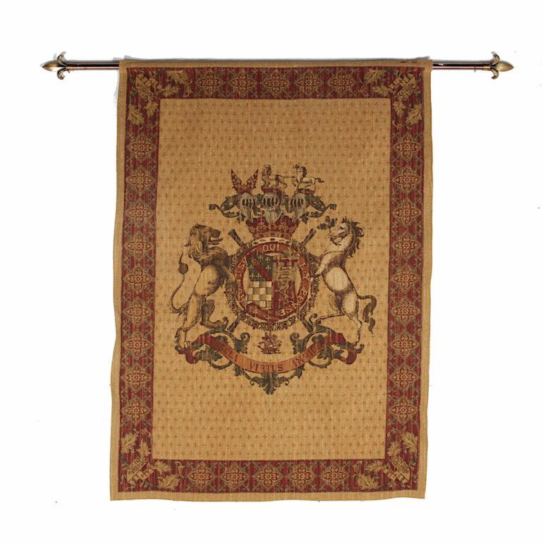 Large vintage tapestry featuring a central heraldic crest, one of three identical tapestries. Latin Translation means ‘Invincible by Virtue.’