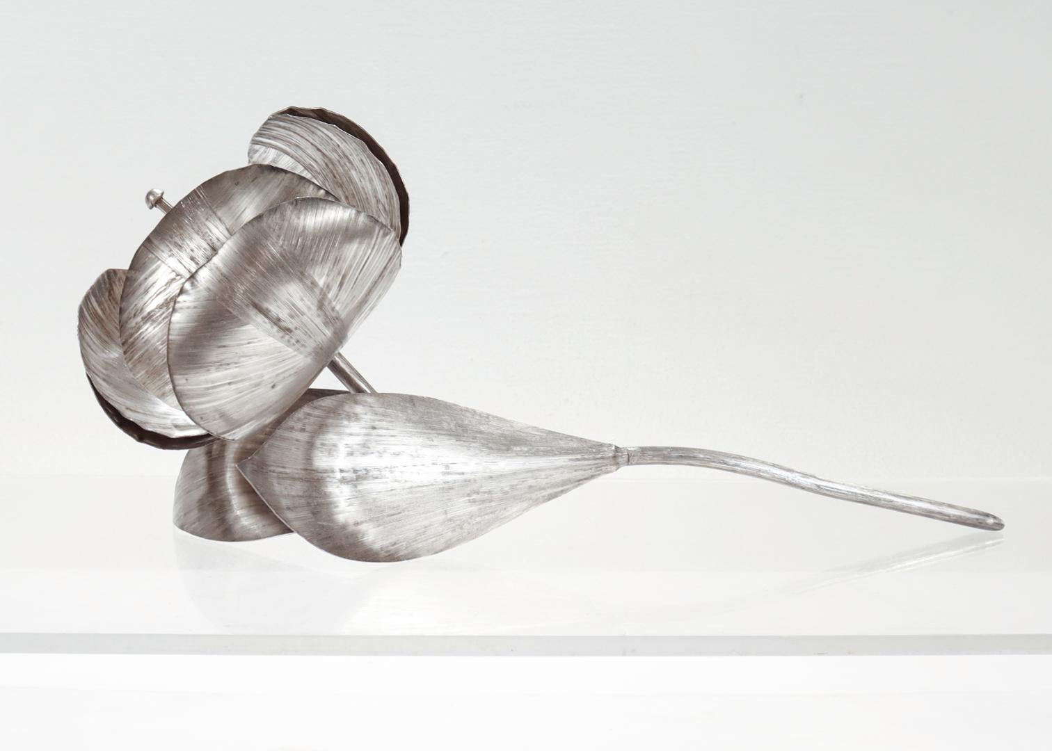 A very fine, oversized Mid-Century figural flower ornament. 

In sterling silver.

By Alfredo Vallasana for Lunt Silversmiths.

In the form of a large tulip flower in full bloom with a long stem and two leaves.

Centered on a threaded (and