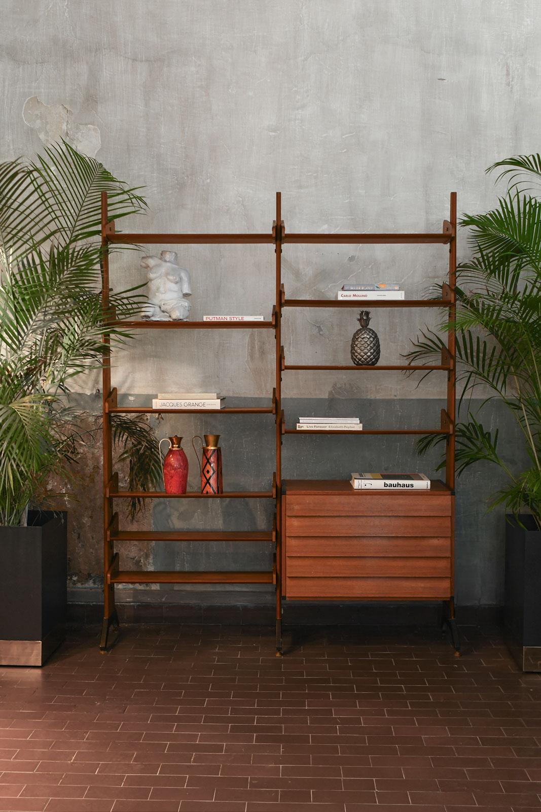Large Teak Bookcase with Shelves, Drawers, and Brass feet. Italy 1960
Product Details
Dimensions: 165 W x 214 H x 41 D