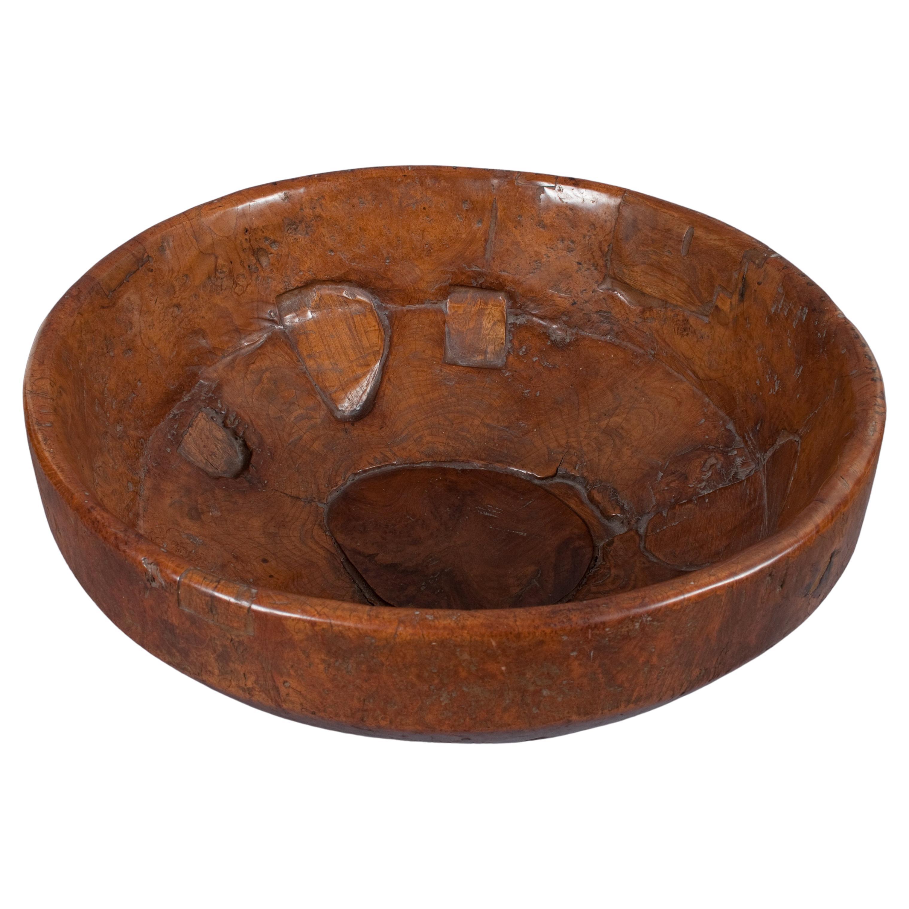 A beautiful bowl, originally a musical frame drum called Terbang, which was used in ecstatic devotional music. The drum was hewn from a single piece of teak burl wood, one of the rarest and most water resistant woods in the world. Repairs and