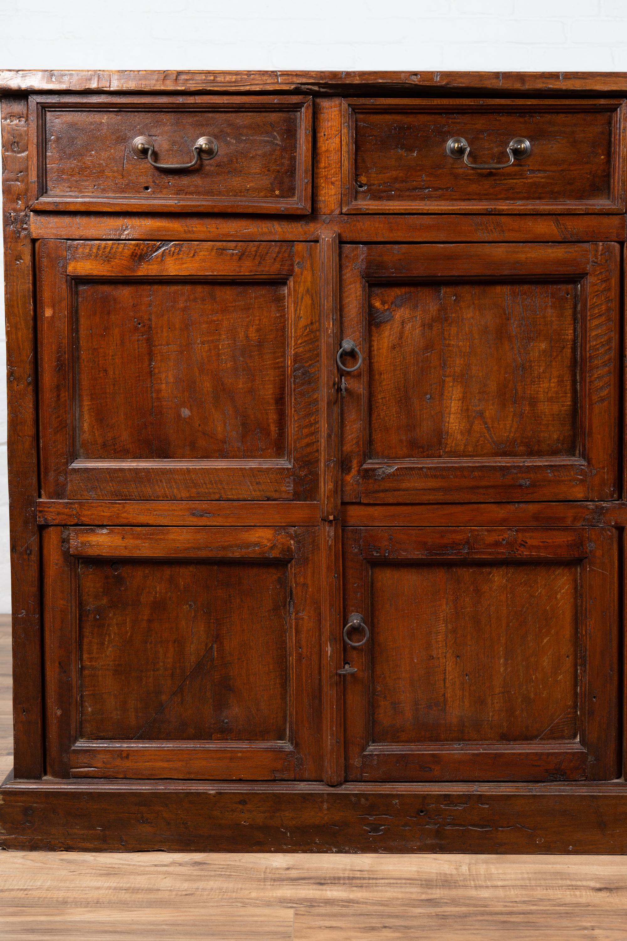 Javanese Large Teak Cabinet from Java, with Four Drawers and Four Sets of Double Doors For Sale