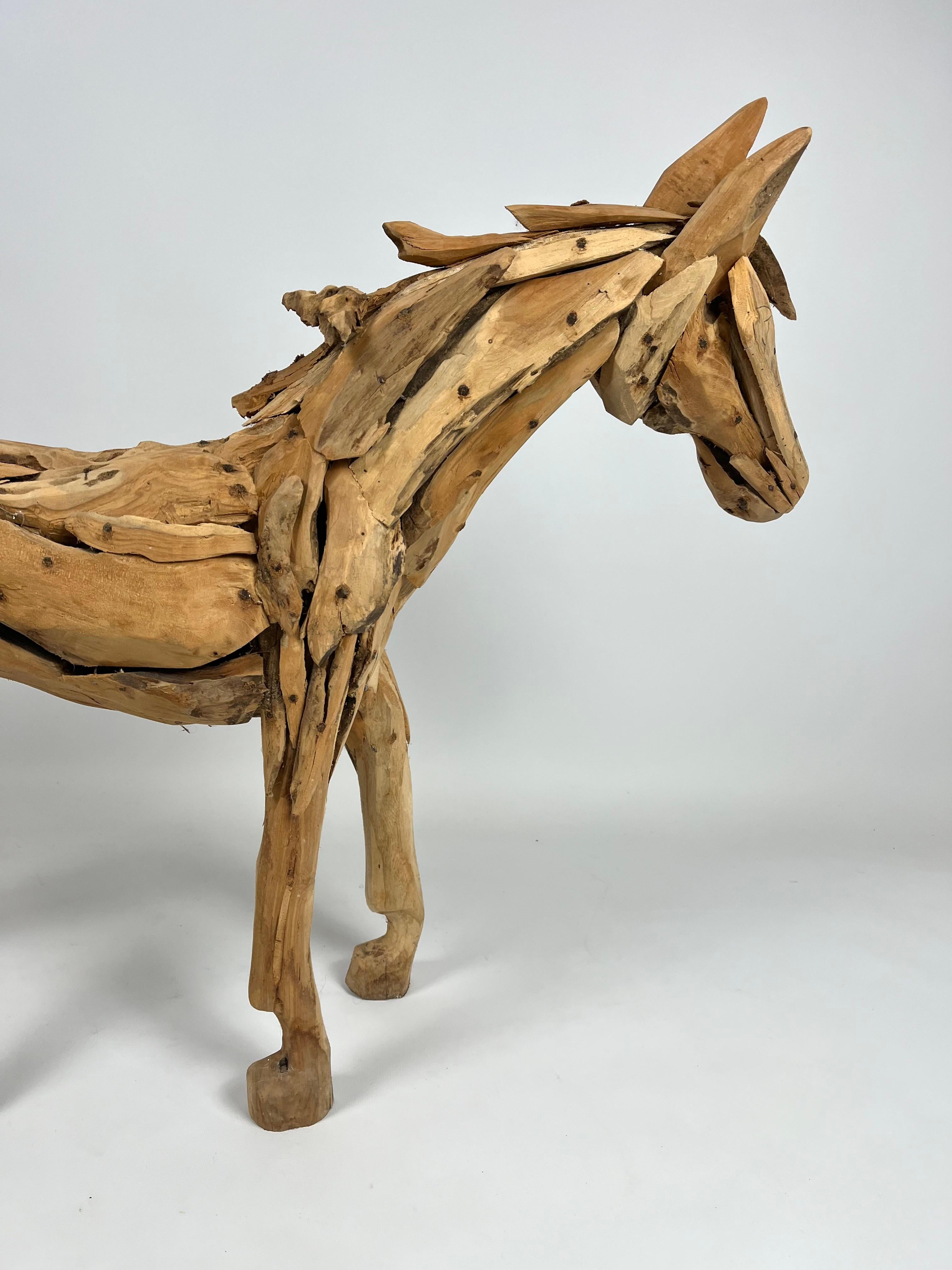 Teak Large teak sculpture of a foal For Sale