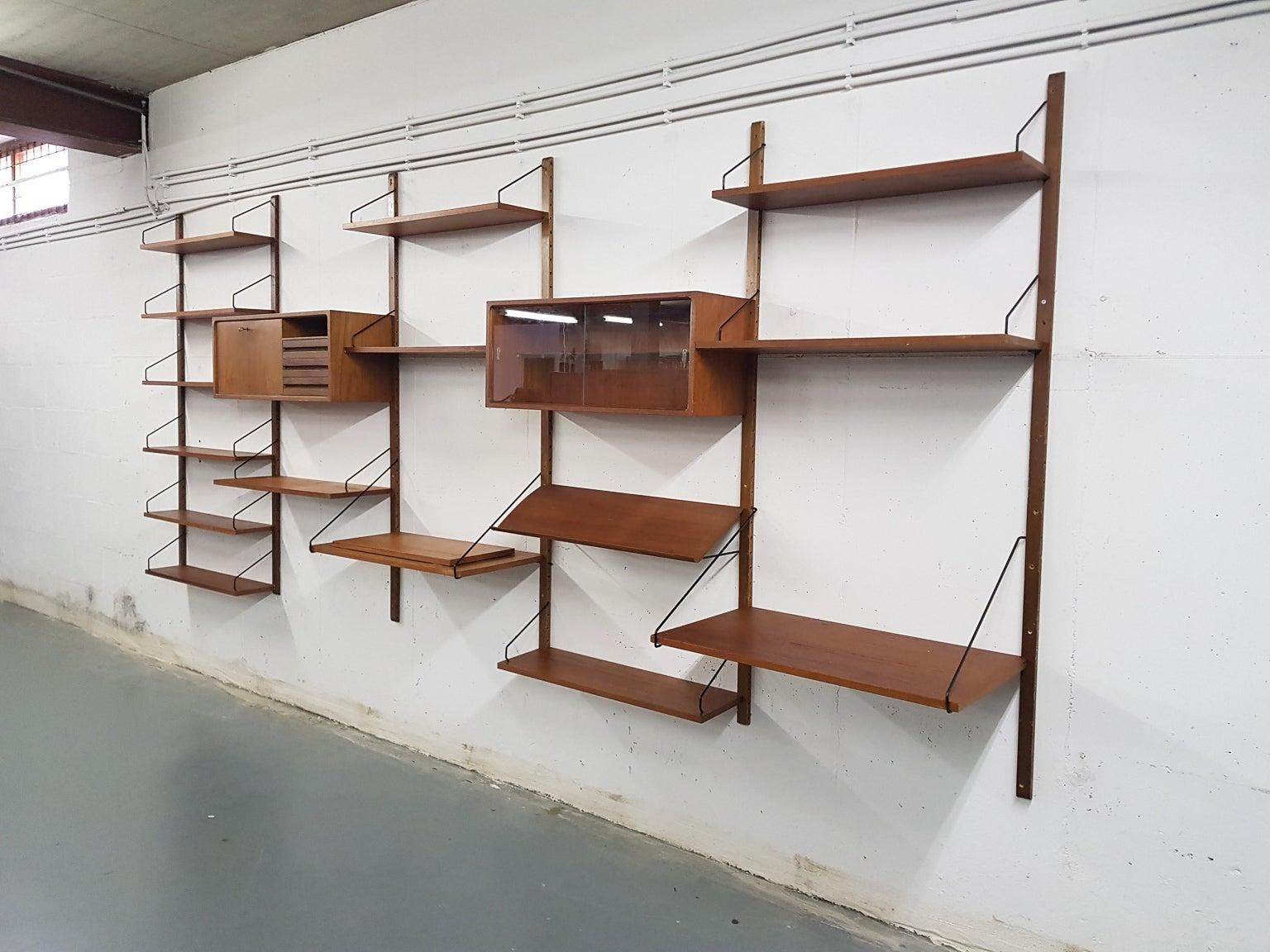 Large Danish design wall system or shelving unit by Poul Cadovius for Royal System, designed in Denmark in 1948.

When you ask someone to think of an European midcentury wall unit, most will probably think of Poul Cadovius and his shelving system.