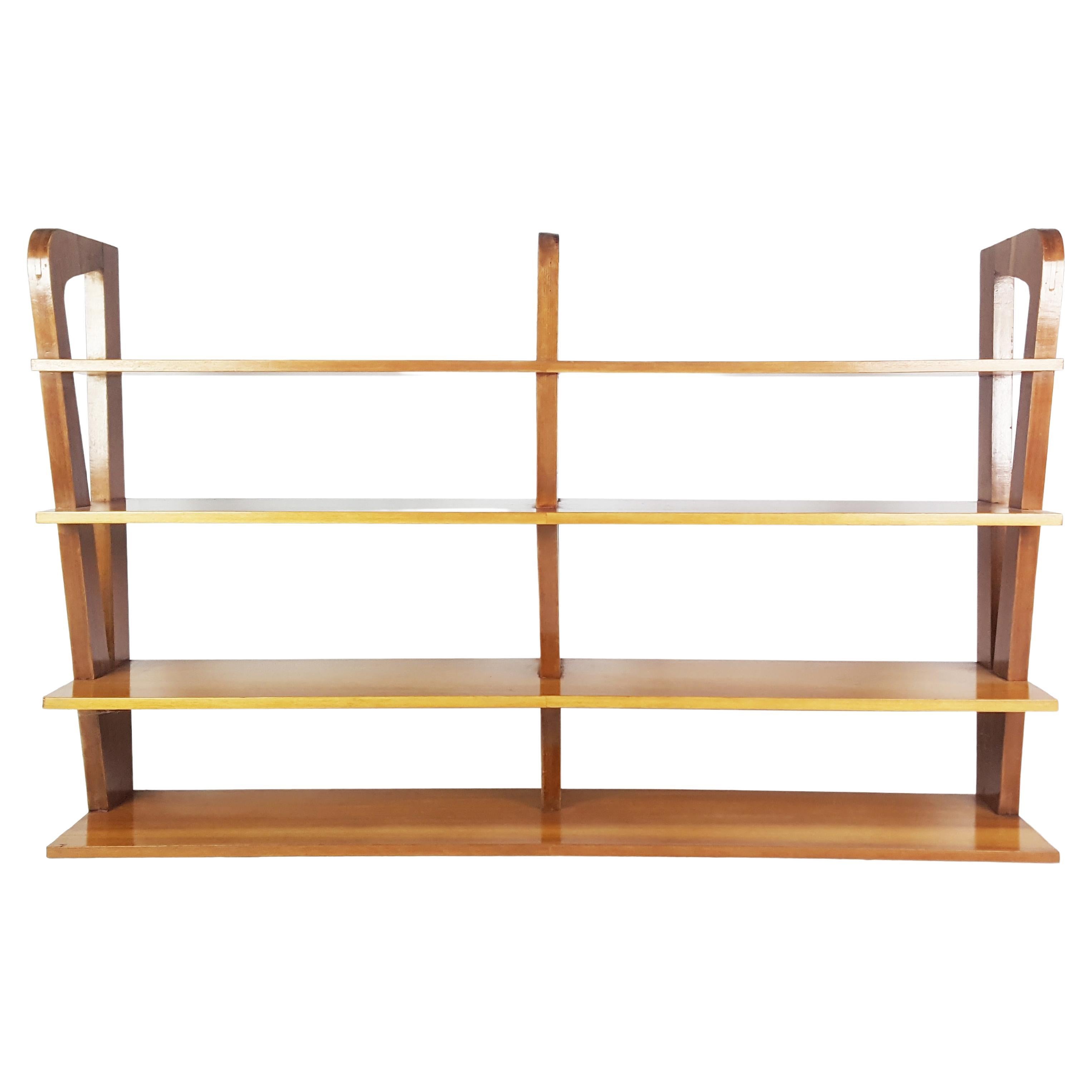 This hanging shelf was produced in Italy around the 1950s. It is made from teakwood and remains in overall good condition.
Shelf is part of a 1950s furniture made in part with furniture produced by ISA. As you can see from the last photo, the set
