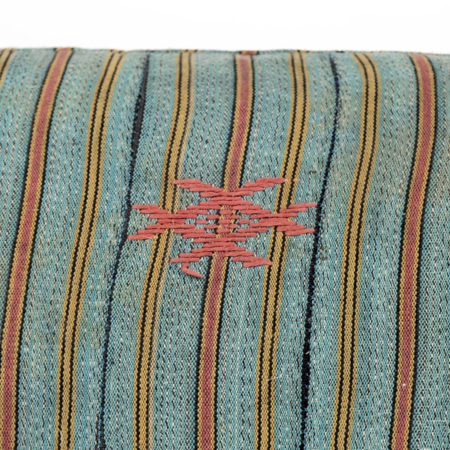 Large teal, gold, navy and coral striped print lumbar cushion hand-sewn from a vintage cotton textile with embroidered decoration. This decorative pillow is self-backed and includes a zip fastener and feather insert. Two available. Sold separately