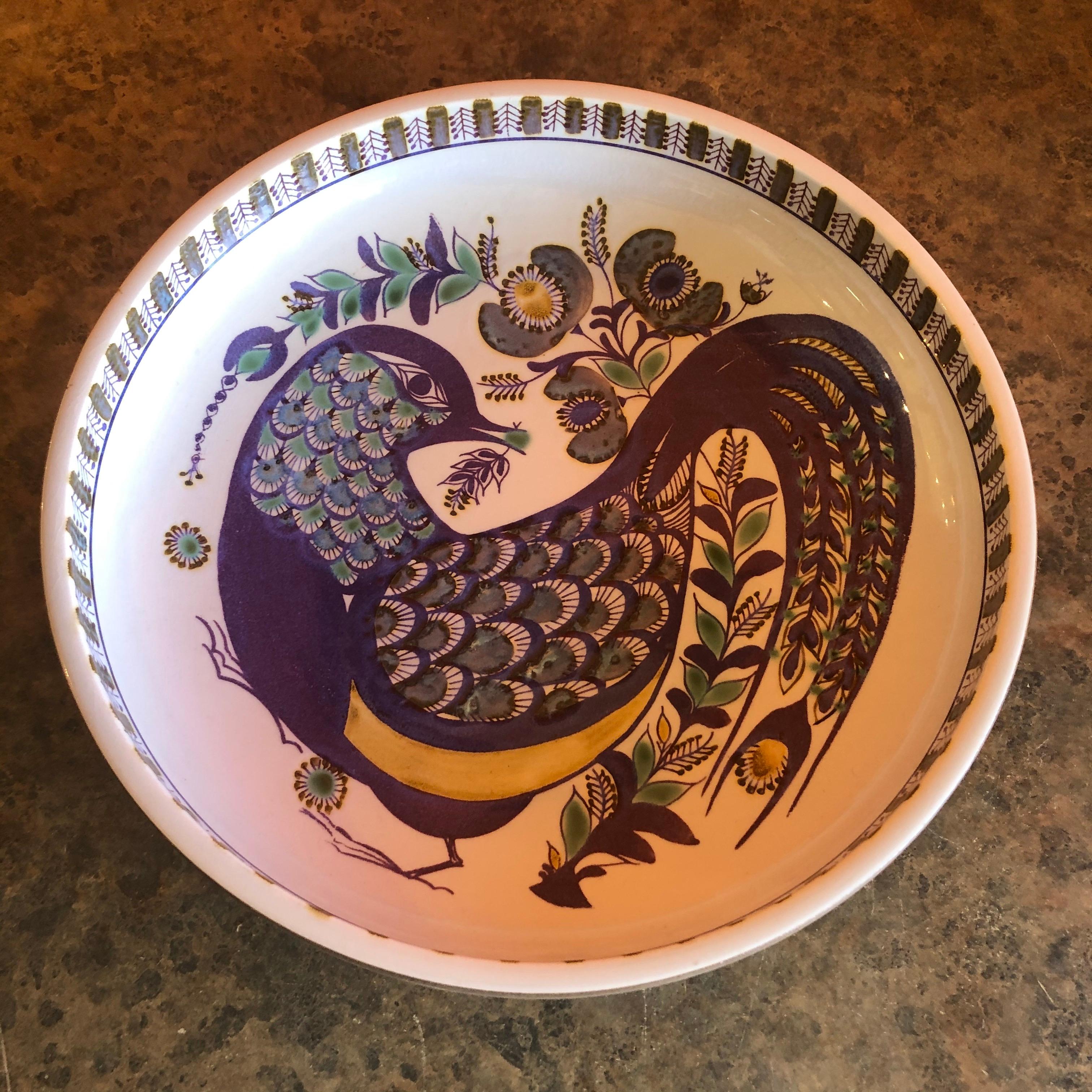 Wonderful large Tenera bowl by Berte Jessen for Royal Copenhagen, circa 1960s. The purple, grey and white glazed stoneware bowl with geometric abstract design around a bird in the center is signed and marked accordingly (440/3177).

The patterns