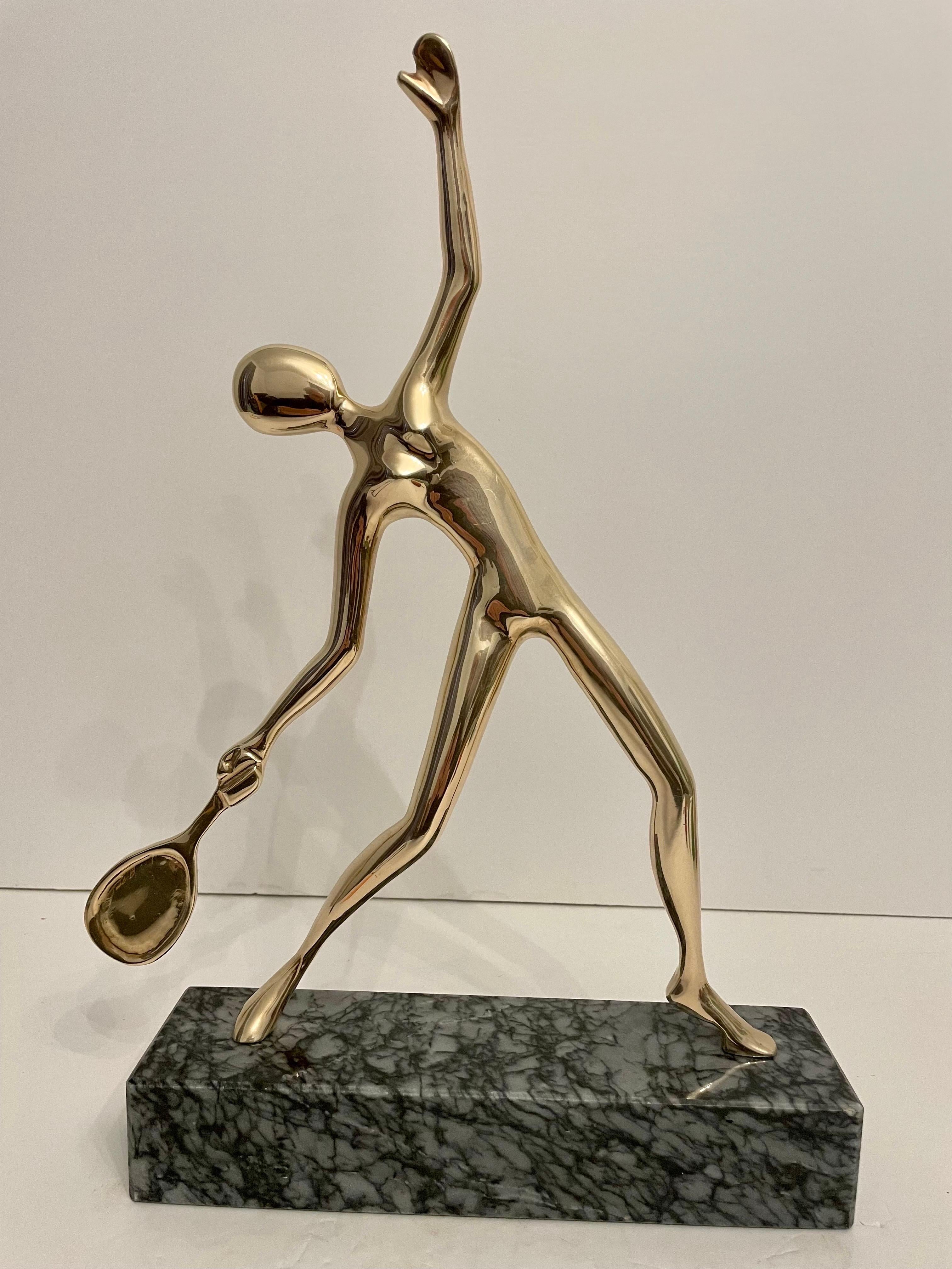 Very unique large heavy solid brass tennis sculpture or statue on grey and black marble base. Great abstract Mid Century form in very good condition. Measures 17.5