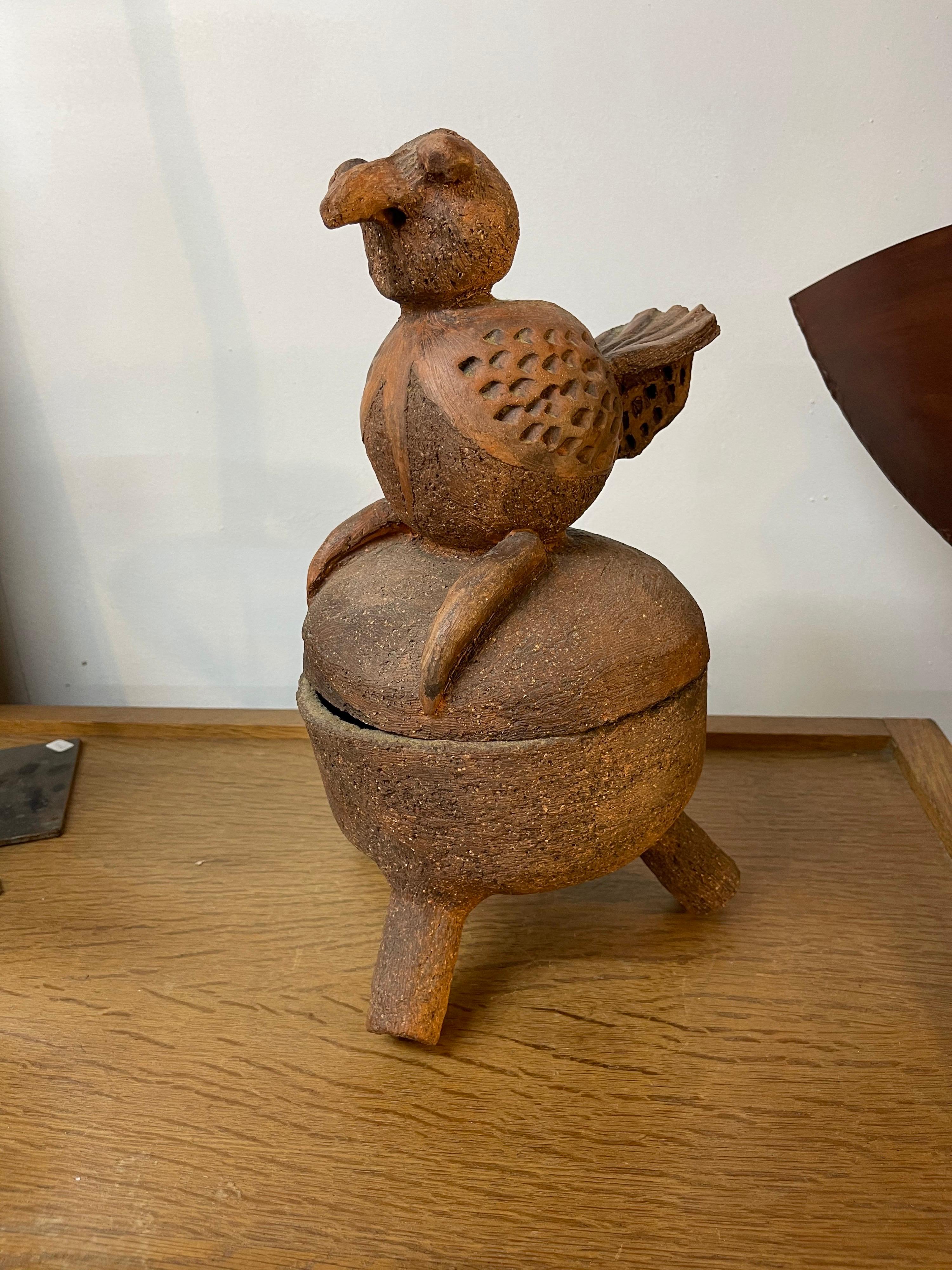 An unusual terracotta ceramic bird by Louis Delorme born in 1934.
