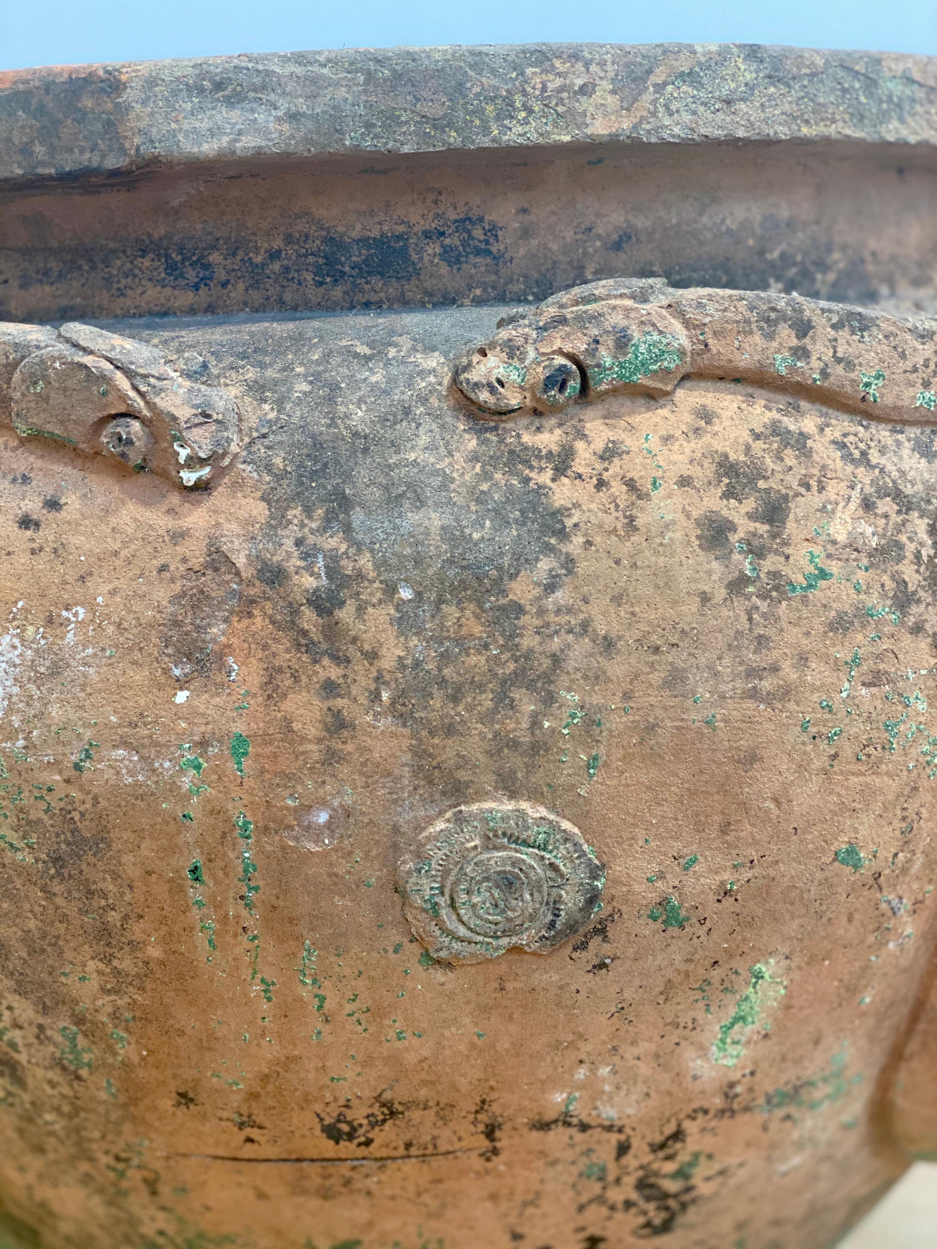 A large 19th century Compton Pottery terracotta pot with serpent decoration. With original Compton Pottery stamp registration number signifying Compton Potter’s Art Guild. Interior has the potter's initials F.C.P., circa 1880. The snake pots were