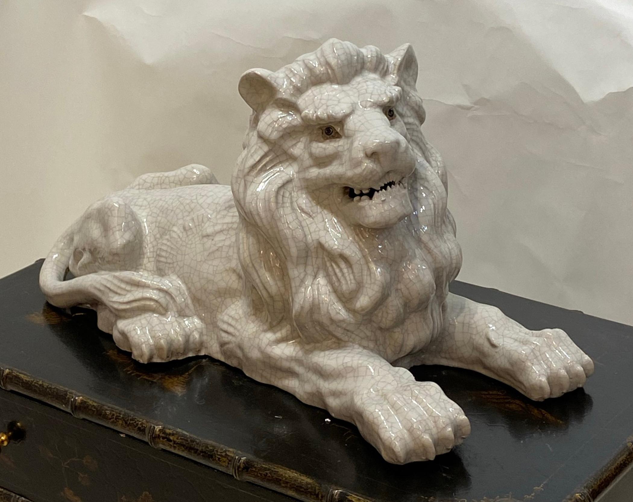 Majestic terracotta lion with white crackle glaze finish. This terra cotta sculpture could be used either indoors or out. In very good condition no chips or cracks.