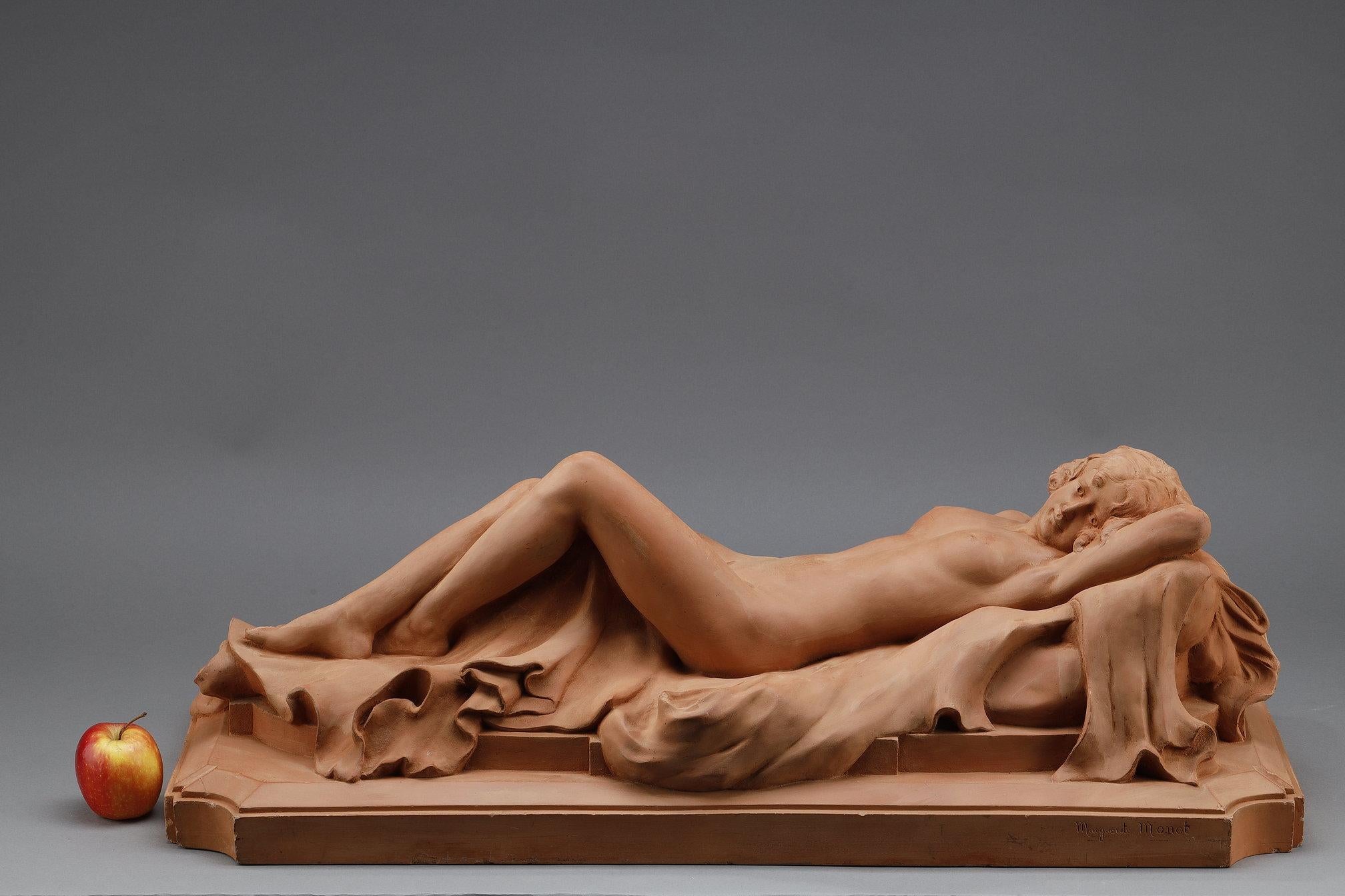 French Large terracotta sculpture depicting an Odalisque reclining on a drape For Sale