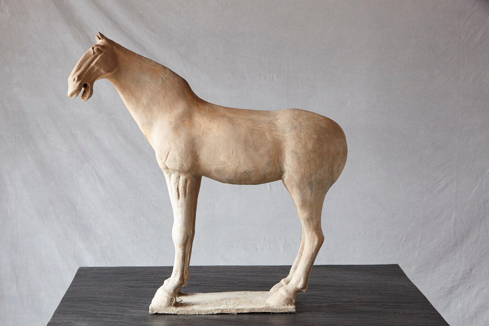 Impressive and very decorative large terracotta horse modeled in the style of the sculptures from the Tang dynasty.
The sculpture shows the raw beauty of the pure, untreated terracotta and is in excellent condition.