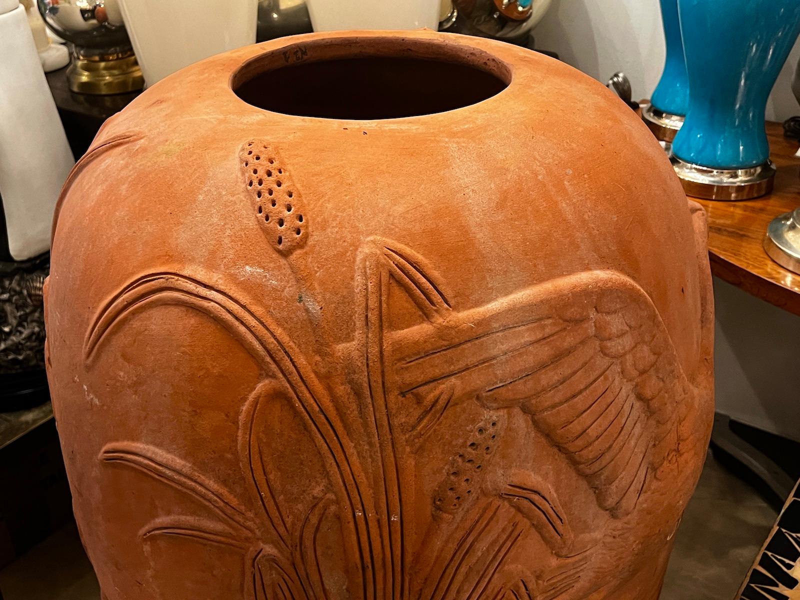 A large Italian circa 1950's terracotta garden vase.

Measurements:
Height: 38