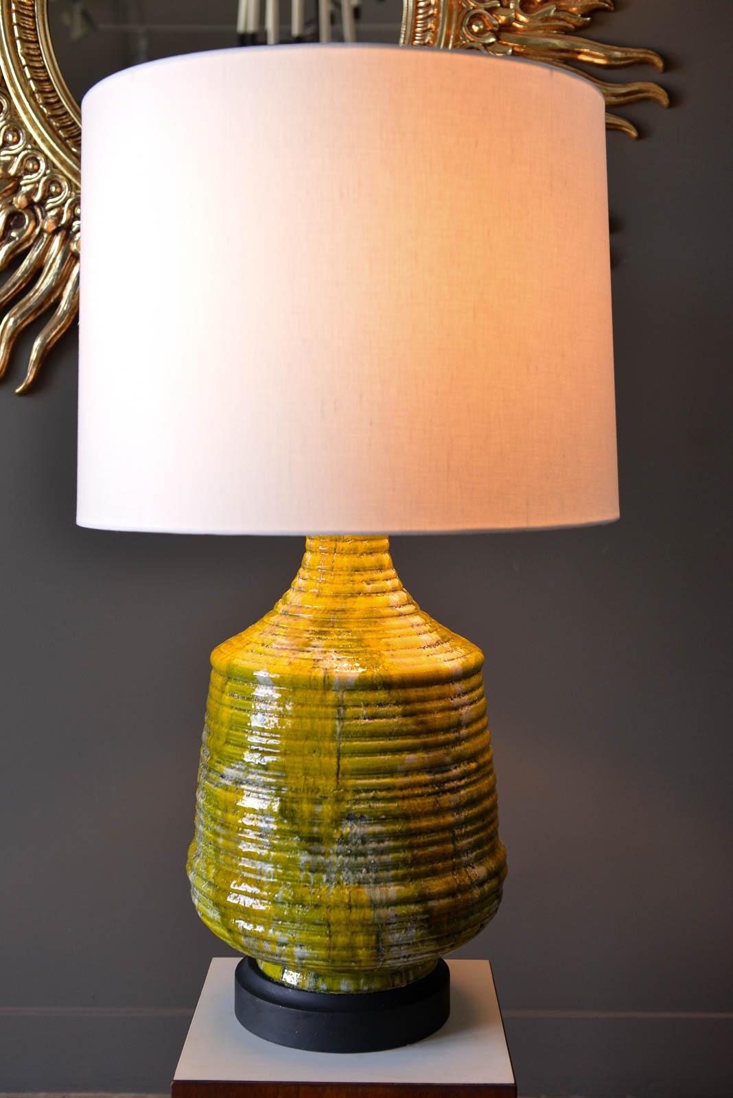 Large textured ceramic table lamp, circa 1975. Original wiring in good condition, with beautiful colors in the ceramic glaze. Some crazing to the lamp, however no chips or cracks. Unsigned. Good working order.

Measures: 13