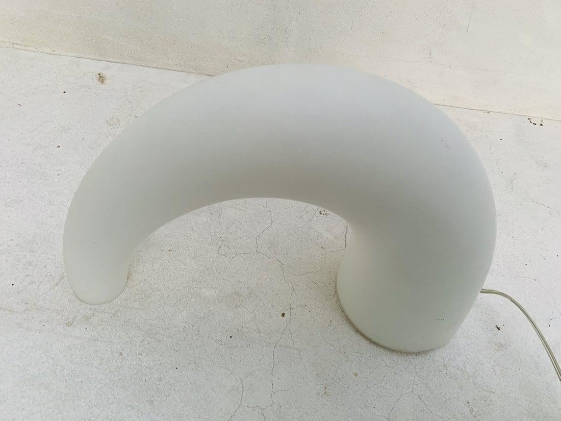 Table lamp with diffused light not dimmable. Diffuser made of opalyne blown glass with satin-finish. Transparent power cable, switch and plug.

Measurements:
15.50 inches wide x 5 inches deep x 10 inches high.