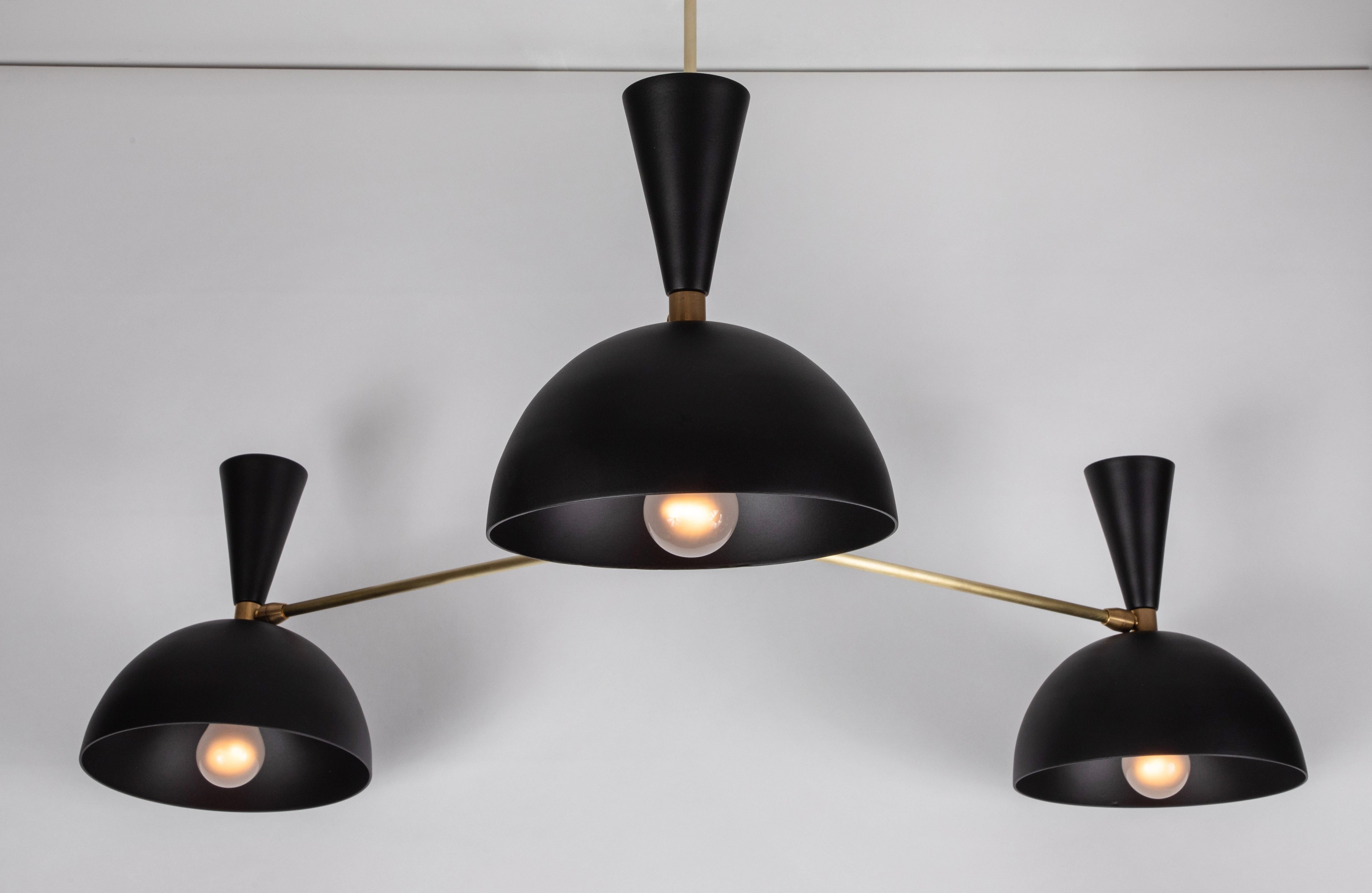 Large three-cone 'Lola II' chandelier in black and brass. 

Hand-fabricated by Los Angeles based designer and lighting professional Alvaro Benitez, this highly refined chandelier is reminiscent of the iconic midcentury Italian designs of Arteluce