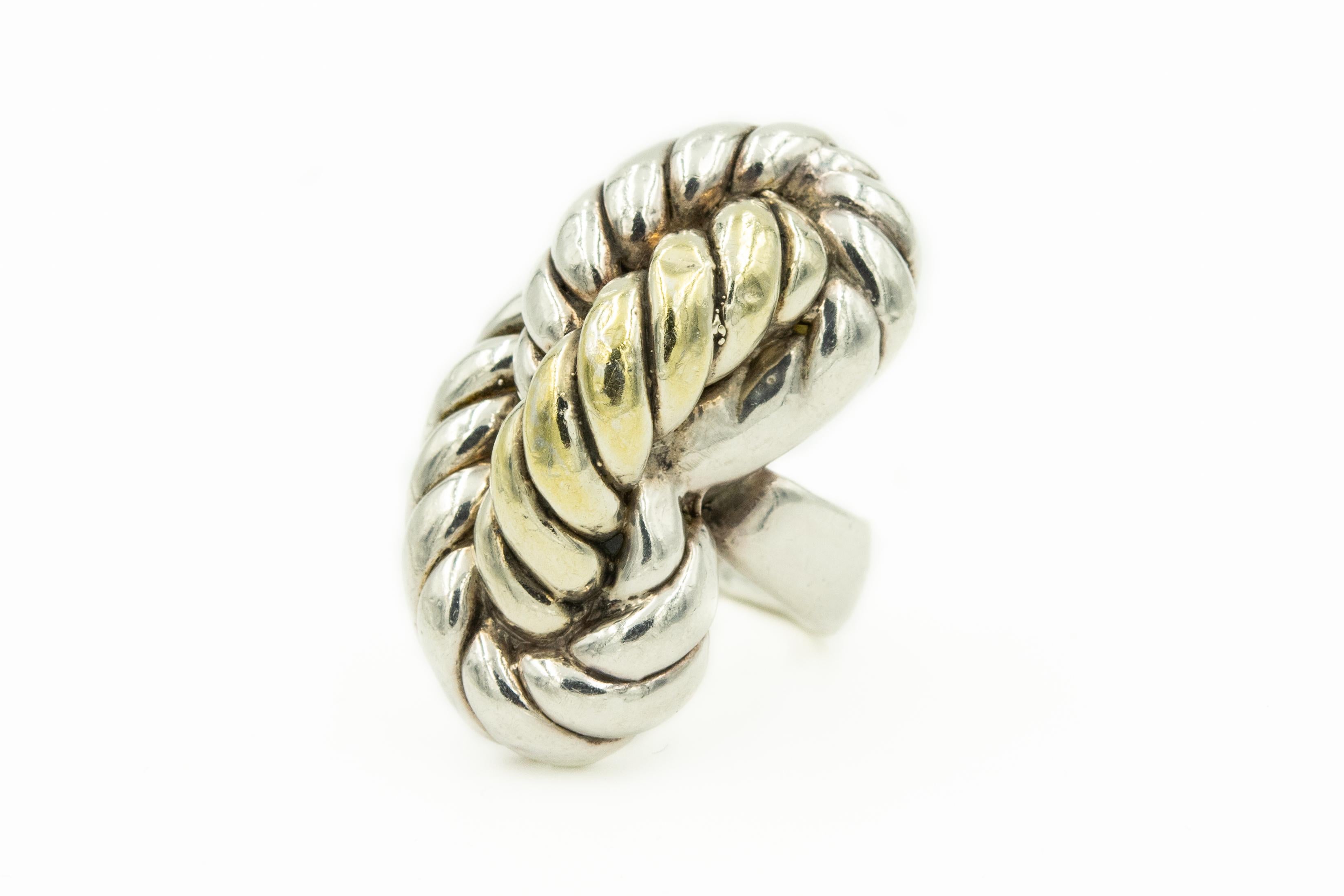 Impressive freeform design sterling silver twisted rope ring with a vermeil section running down the middle.
Marked 925
US Size 7 - it can't be sized.