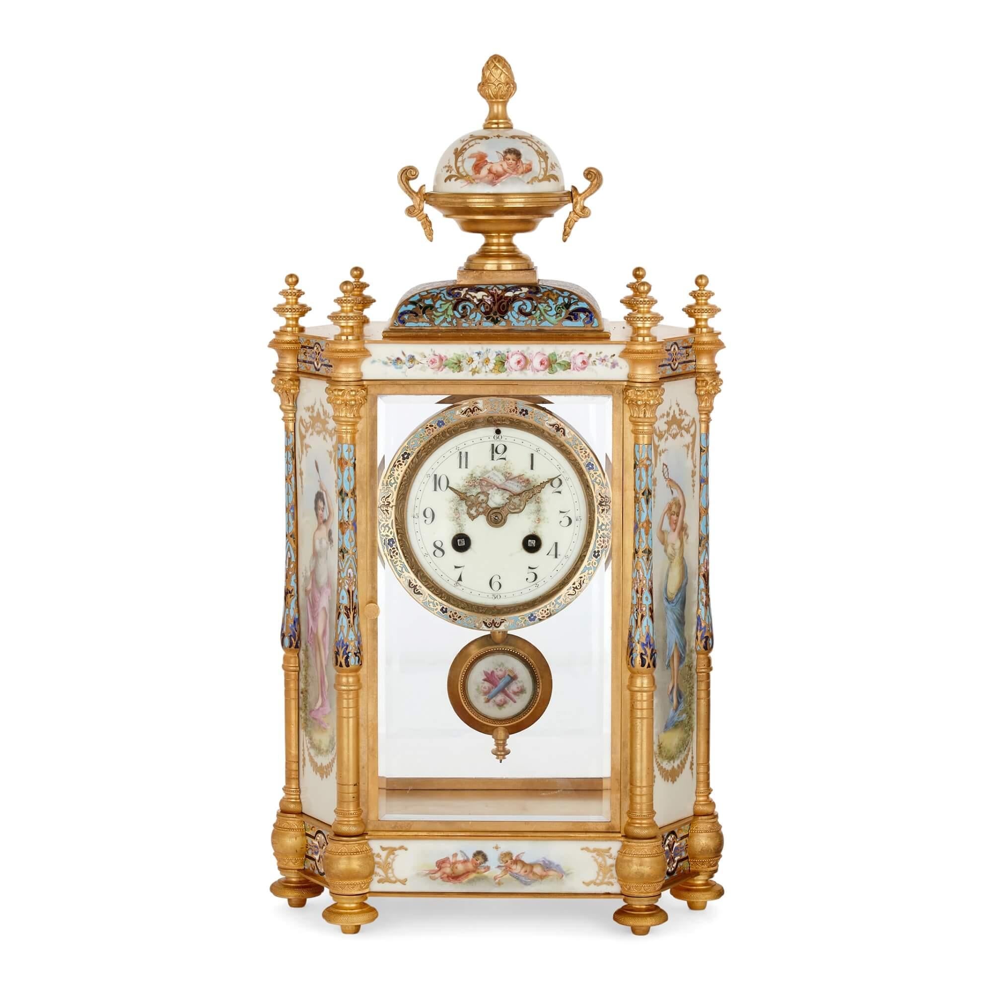 Large three-piece porcelain, champlevé enamel, and ormolu mounted clock set
French, late 19th century
Measures: Clock: height 46cm, width 25cm, depth 15cm
Vases: height 38cm, width 14cm, depth 11cm

This exceptional antique clock set consists