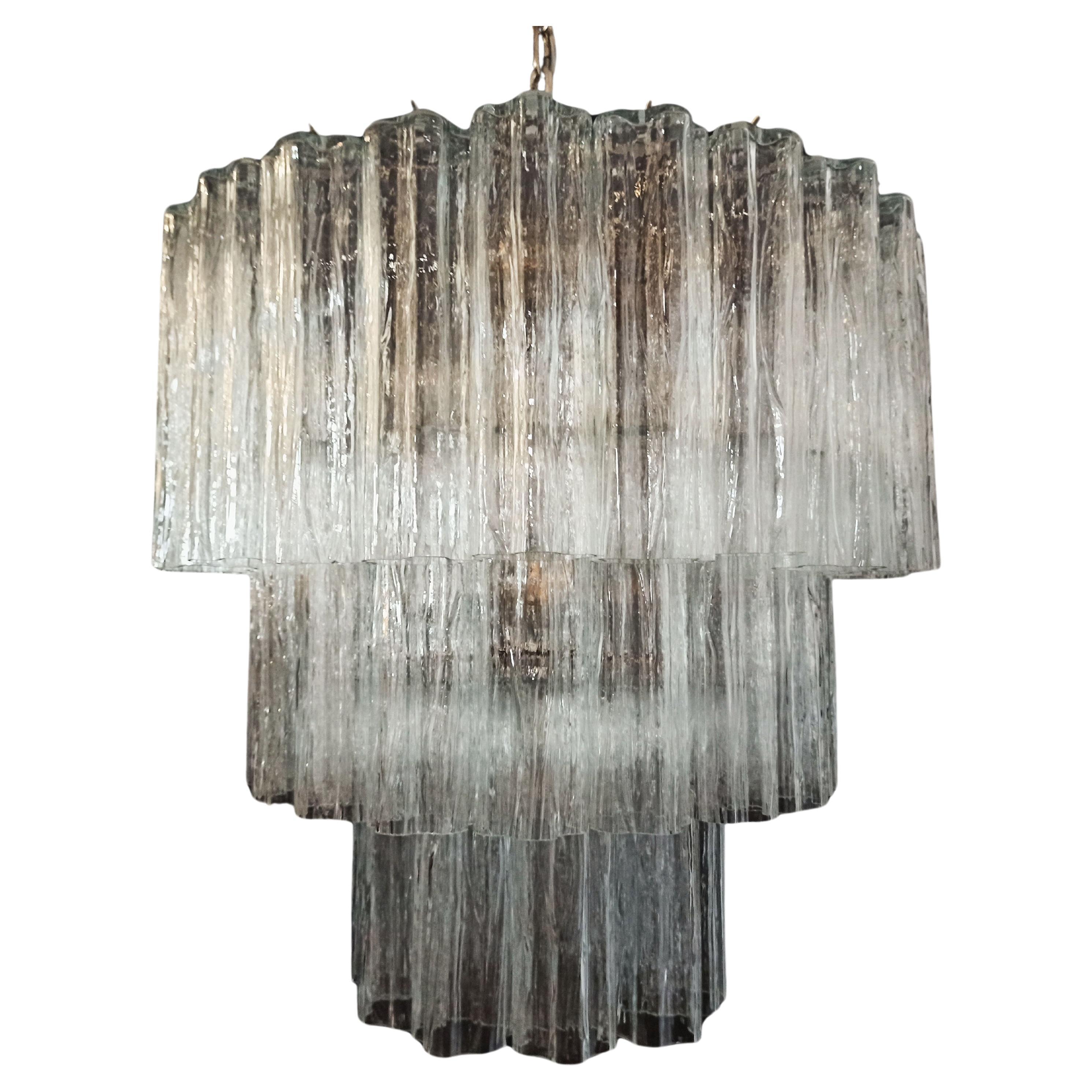 
Italian vintage chandelier in Murano glass and nickel-plated metal structure. The armor polished nickel supports 52 large clear glass tubes in a star shape.
Period: late XX century
Dimensions: 54,20 inches (140 cm) height with chain; 29 inches (75