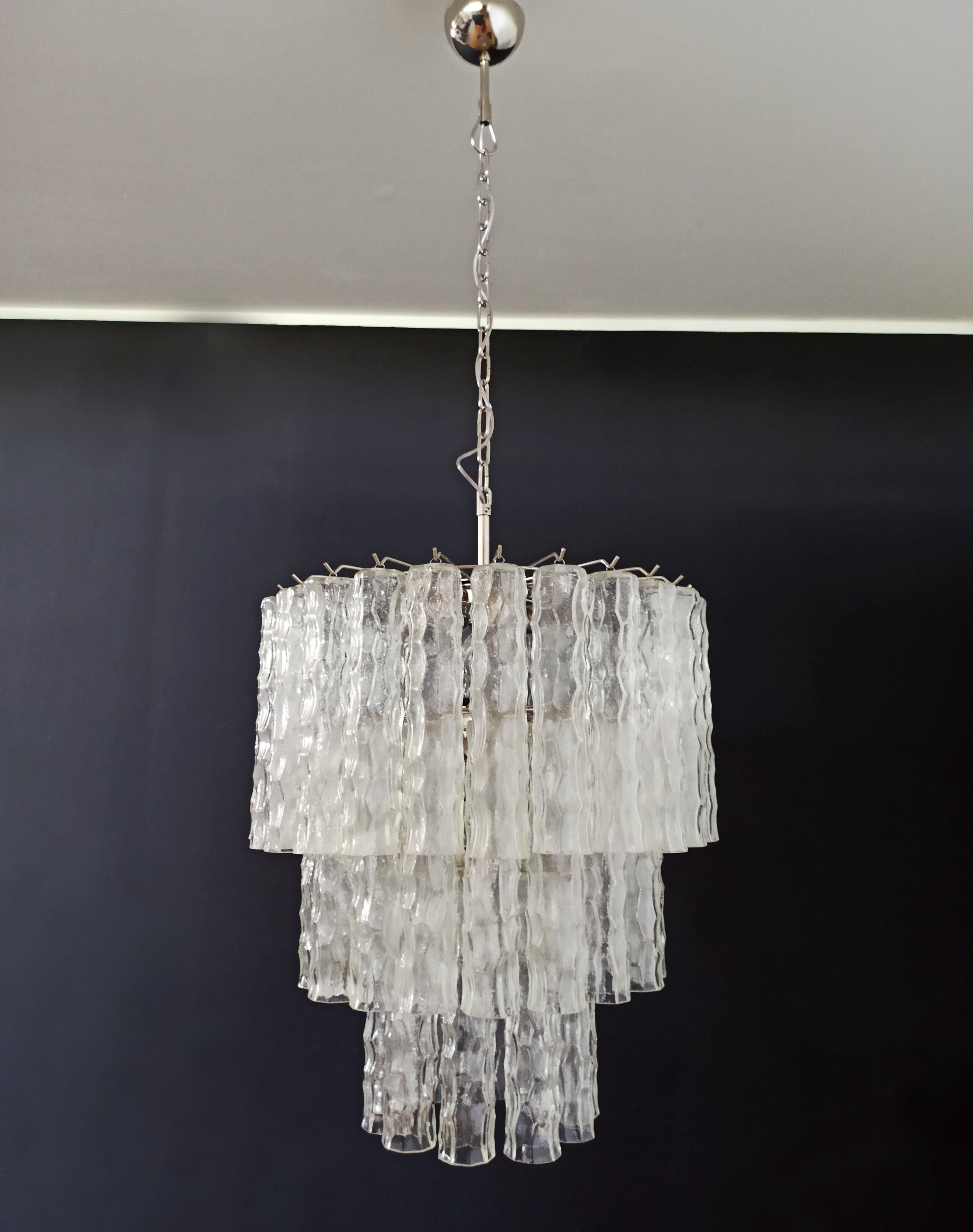Vintage Italian Murano glass chandelier and nickel-plated metal structure. The shiny nickel armor supports 52 large clear glass tubes that have a slightly hammered effect to create
an impressive 
