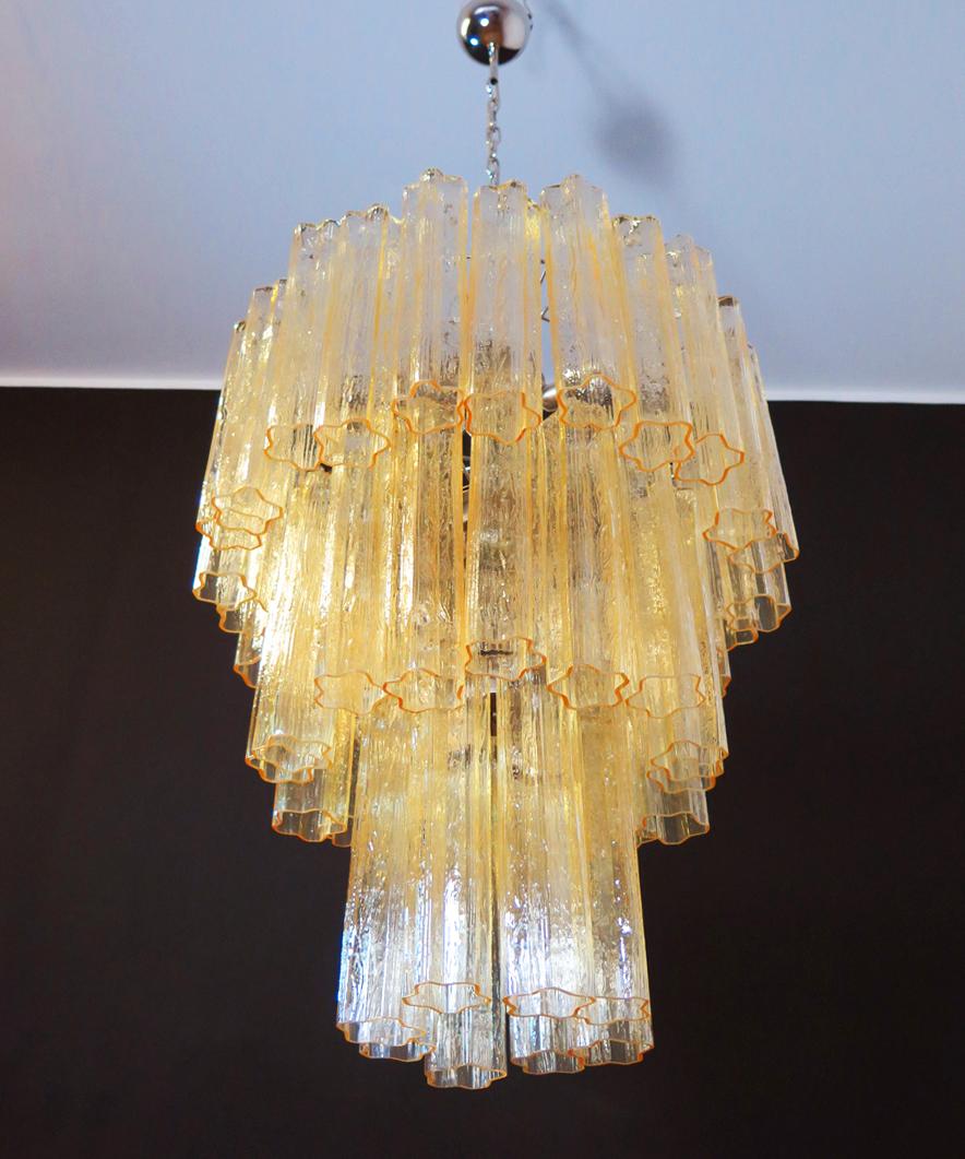 Italian vintage chandelier in Murano glass and nickel-plated metal structure. The armor polished nickel supports 48 large clear amber glass tubes in a star shape.
Period: 1980s
Dimensions: 59 inches (150 cm) height with chain; 29.50 inches (75 cm)