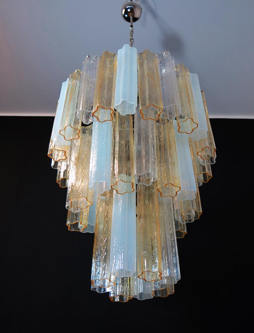 Italian vintage chandelier in Murano glass and nickel-plated metal structure. The armor polished nickel supports 48 large glass tubes in a star shape. The glasses have three beautiful colors, amber, transparent and opal silk; object of rare