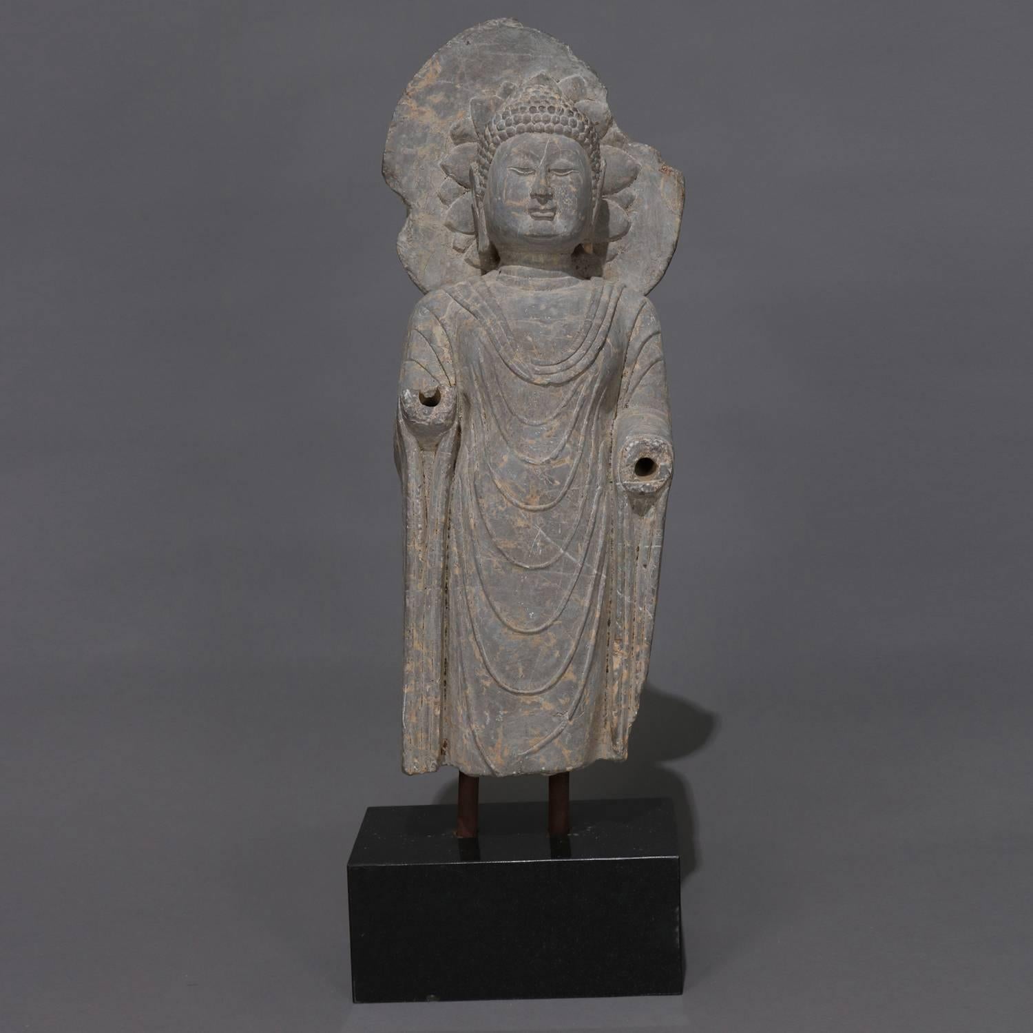 Large antique Tibetan carved stone religious sculpture of Buddha mounted on marble base, 20th century

Measures: 33