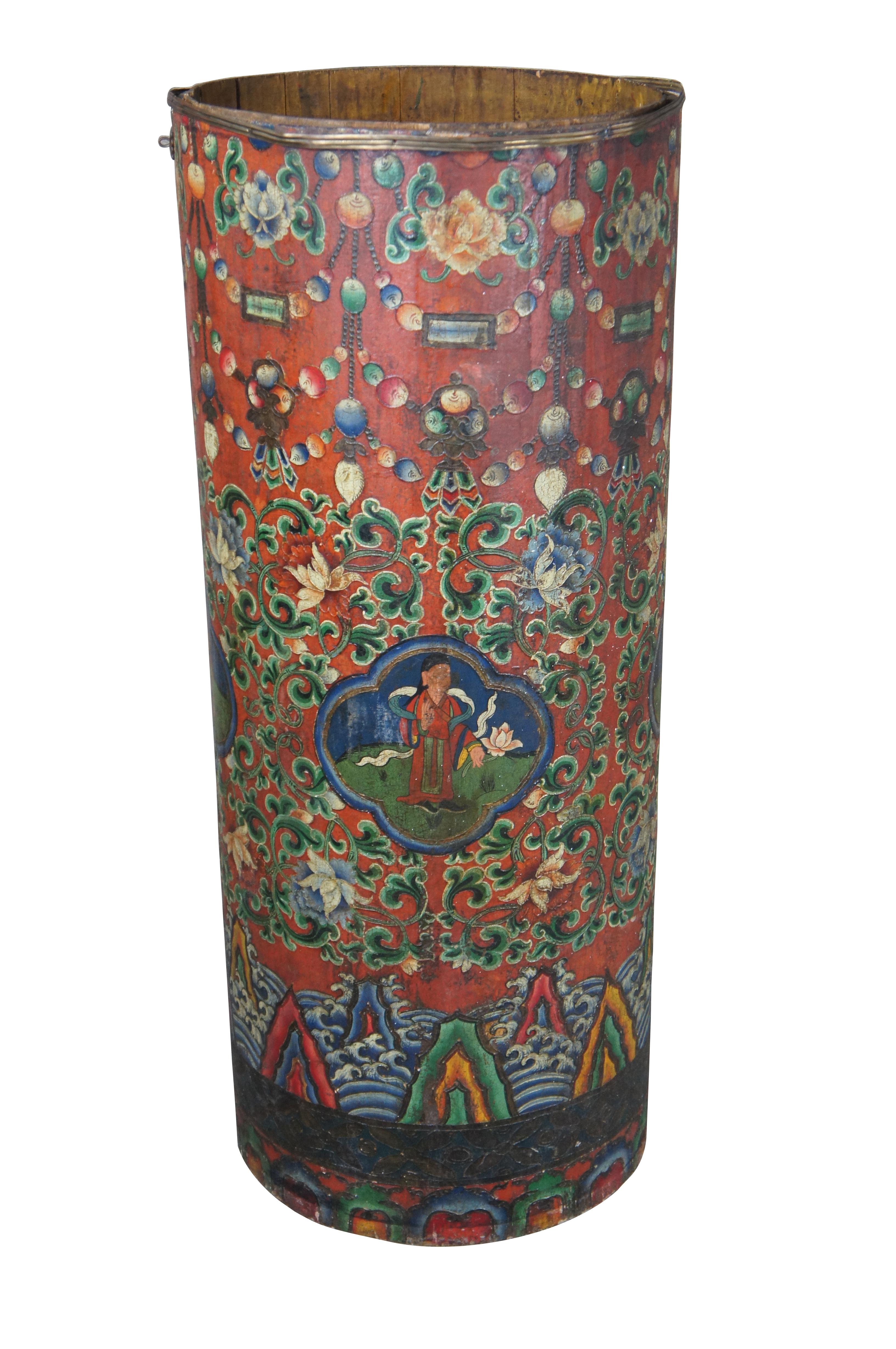 20th Century Tibetan hand painted cylindrical box, barrel, bin or umbrella stand. Features a vibrant polychrome pattern featuring foliate and beaded designs. Mountains and clouds can be seen at the base as well as a different figure at every quarter