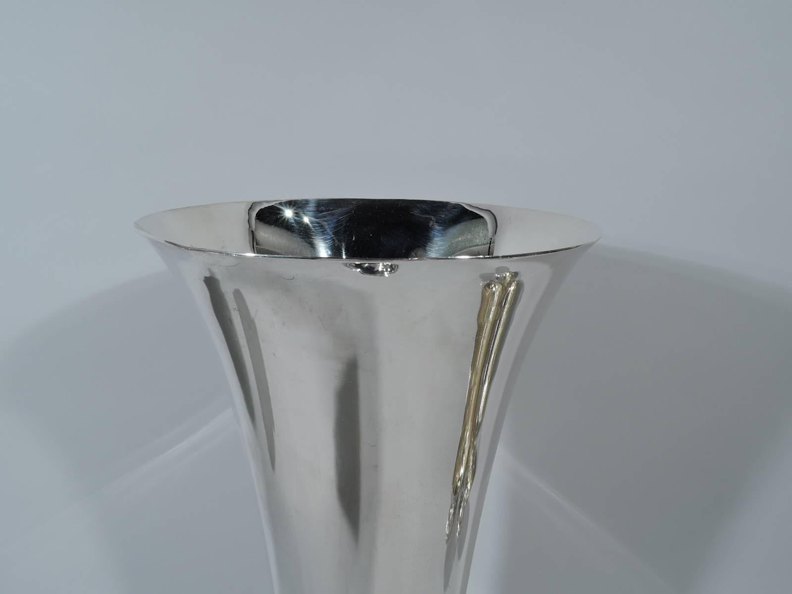 Large sterling silver trumpet vase. Made by Tiffany & Co. in New York. Full-bodied and substantial with flared rim, knop, and stepped foot. Girdled at bottom. Hallmark includes pattern no. 20689 (first produced in 1926) and director’s letter m
