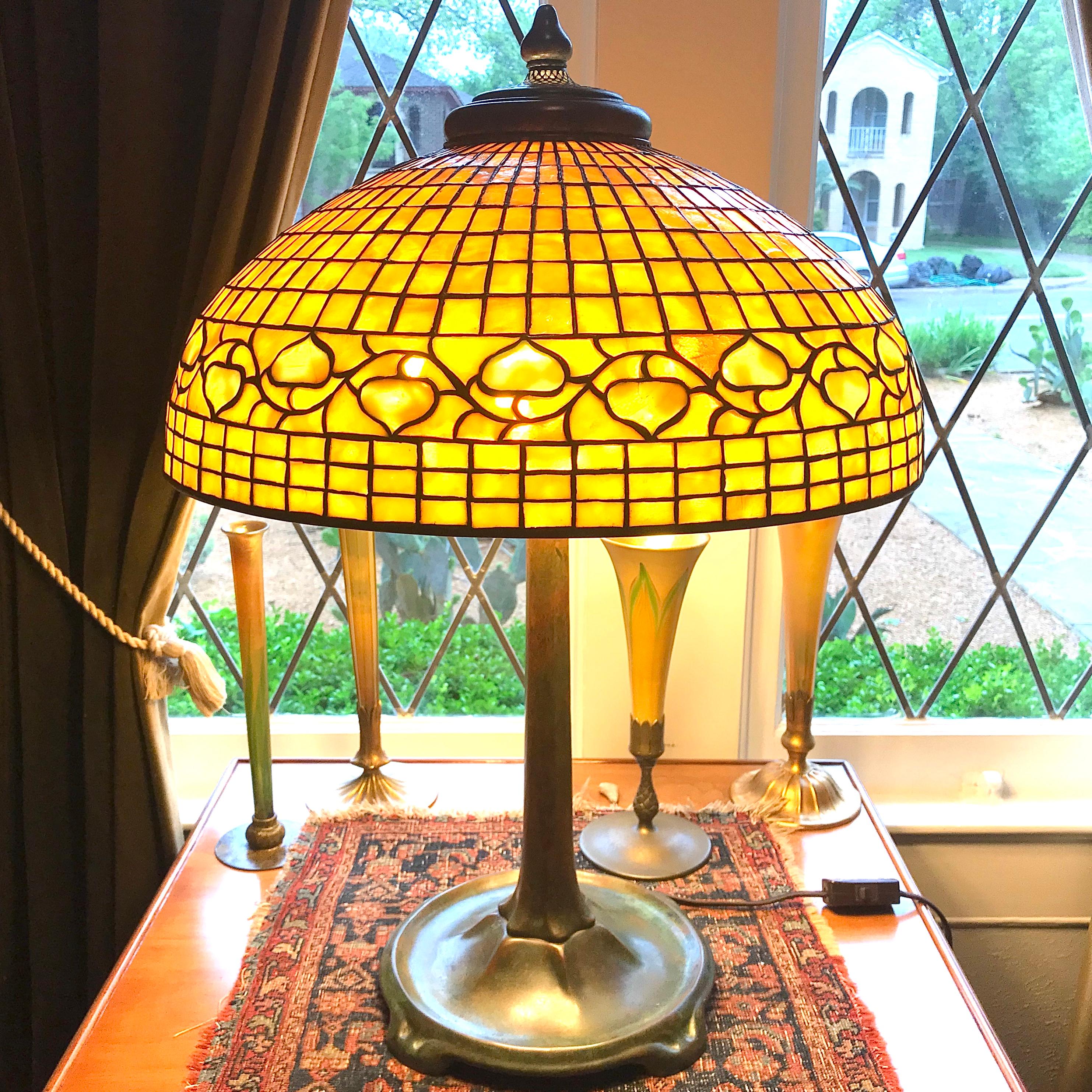 A large and beautiful Tiffany Studios New York acorn stained glass and patinated bronze table lamp, circa 1910 

Picture a standard Tiffany studios lamp at 21 inches tall and 16 inch diameter and double that size in your head. This is a formidably