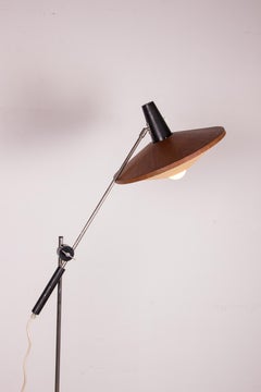 Large tilting floor lamp in Steel and Teak by Georges Frydman 1960.