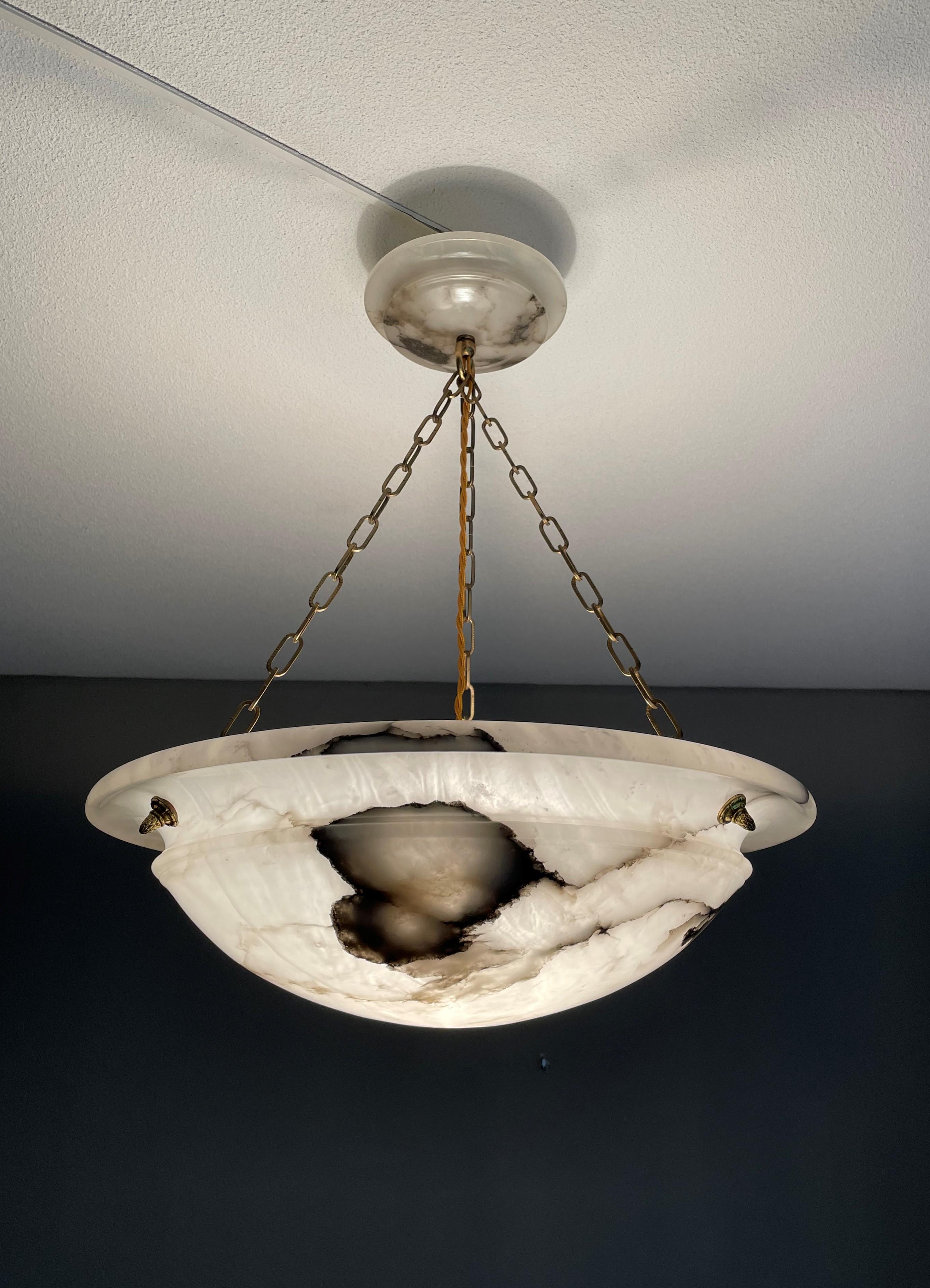 French Art Deco elegance for interior designers who wish to impress their clients.

If you are looking for a large size, beautiful, timeless, impressive and ready to use alabaster chandelier then this striking French light from circa 1920 could be