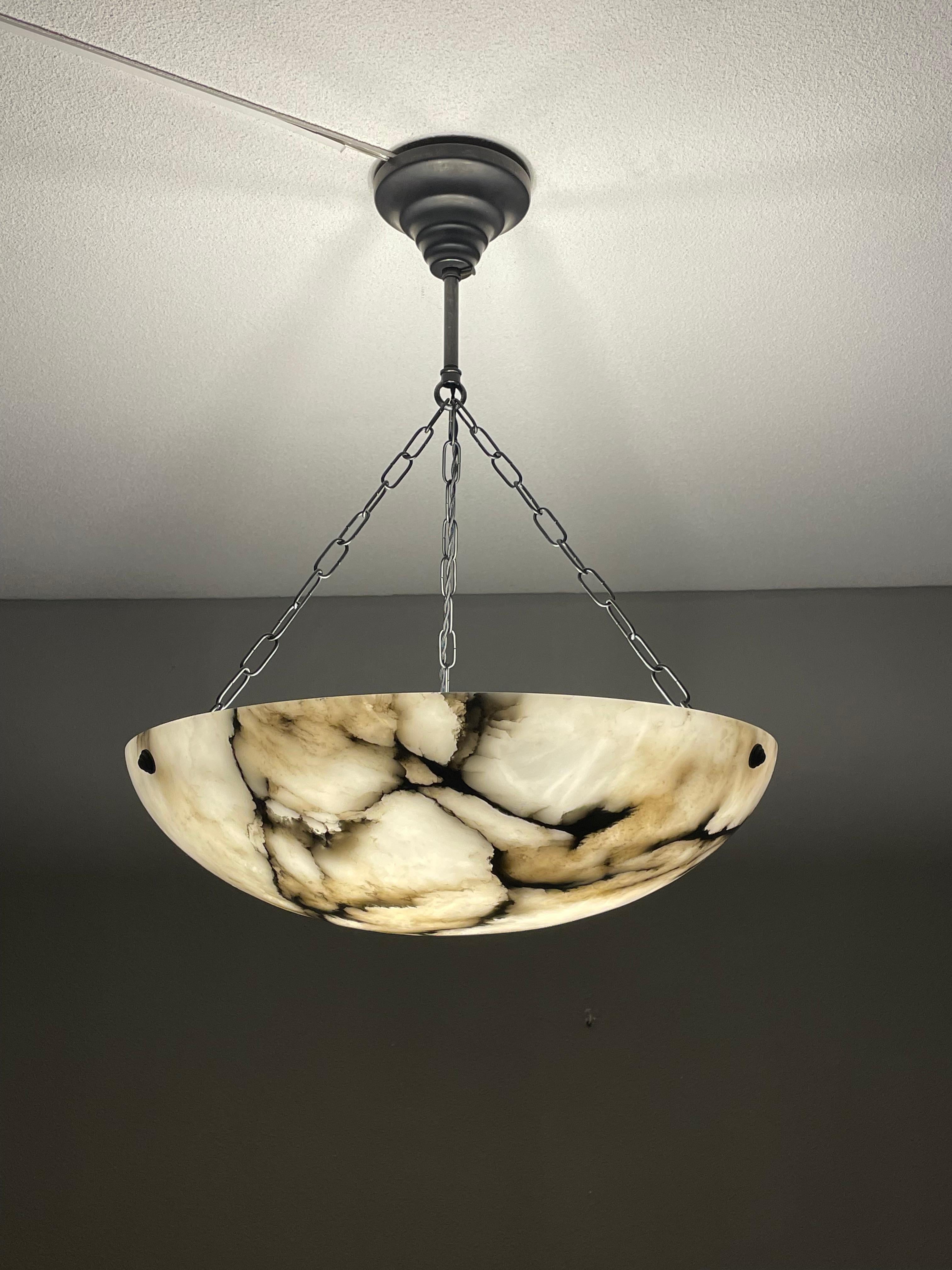 Superb condition and timeless design alabaster chandelier.

Thanks to its large size, its very good condition and its timeless design this three light alabaster chandelier too is bound to light up someone's days and evenings soon. It is in great