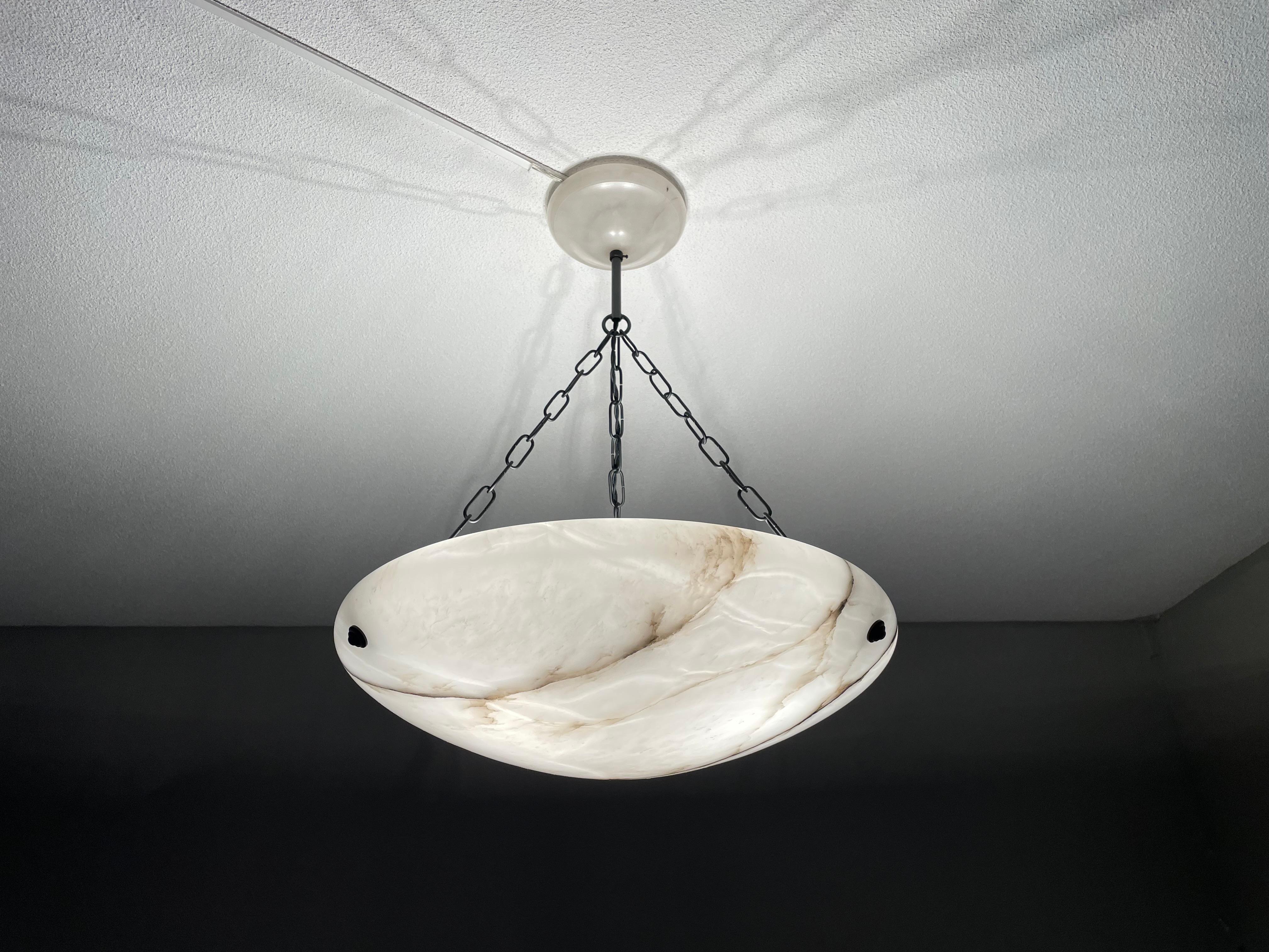Superb condition and timeless design alabaster chandelier.

Thanks to its large size, its excellent condition and its timeless design this three light alabaster chandelier too is bound to light up someone's days and evenings soon. It is in the best