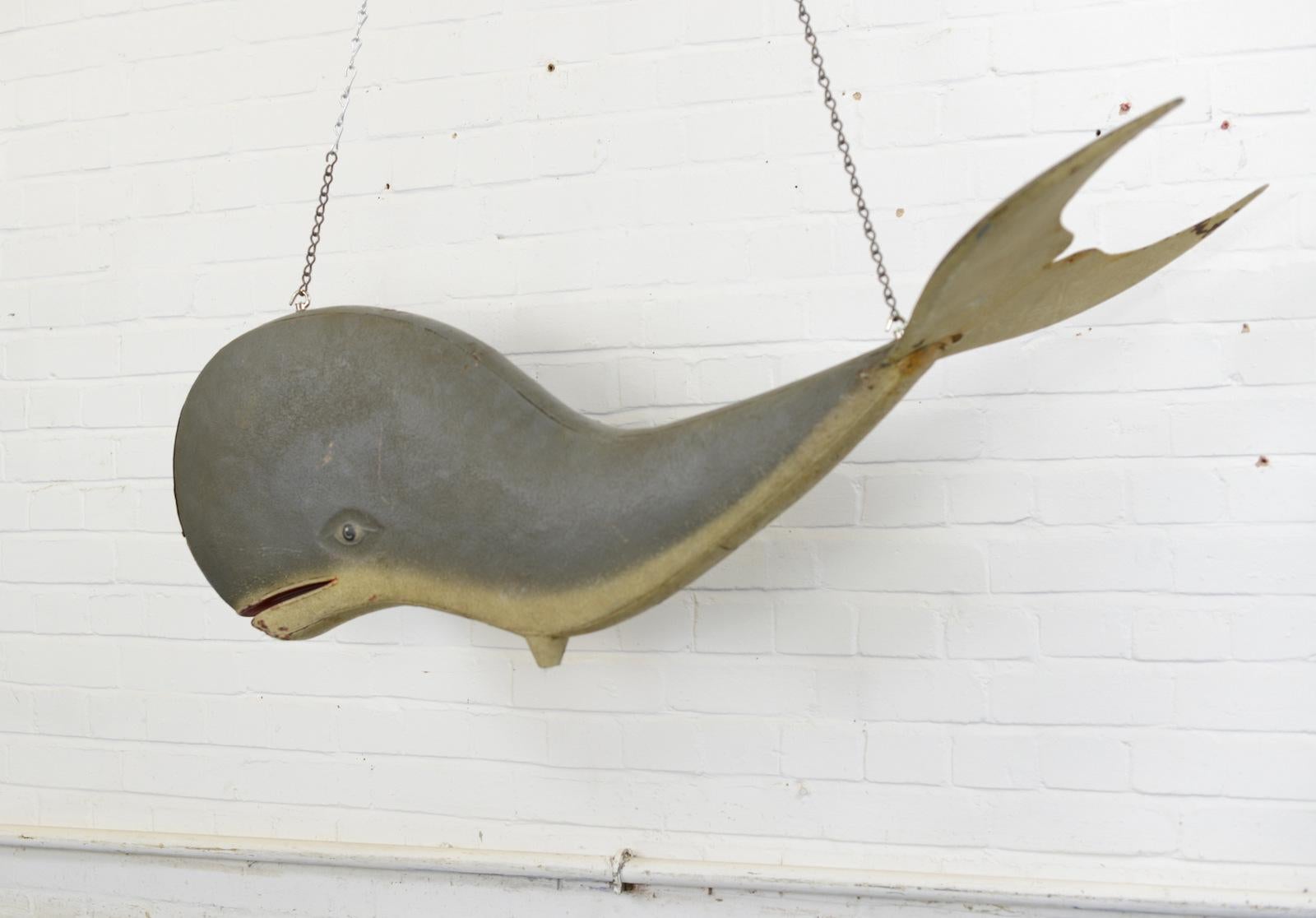 Large tin Folk Art whale, circa 1930s

- Hand painted on tin
- 3D double sided
- English, 1930s
- 142 cm long x 56 cm wide x 40 cm tall

Condition report

Some chips to the paint and small rust spots.
  